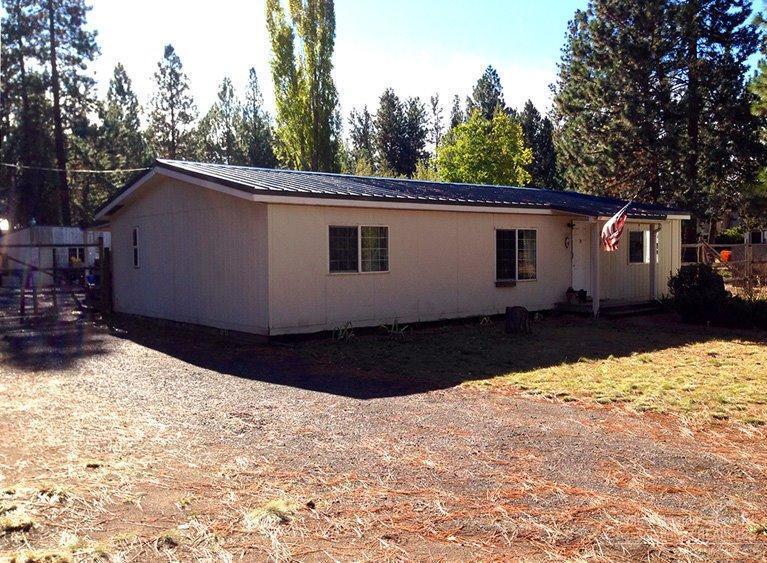 Great manufactured home on large property lot in Deschutes River Woods. This home has some updating to it, including tile, laminate floors and carpet. This property sits just off of Brookswood. Conveniently located with easy access to HWY 97 and close to Elk Meadow elementary school. This property has tie downs, metal roof, shop and can be financed. The home needs to sell ASAP. Seller will consider all offers.
