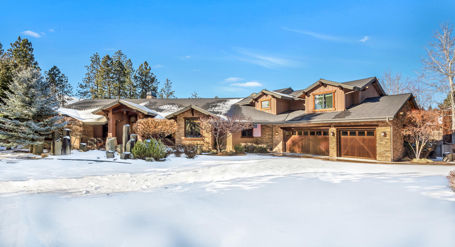 Incomparable setting with uncompromising finishes throughout, this custom riverfront masterpiece feels like a private retreat but is conveniently located in a gated community of RiverRim in SW Bend. This estate home sits on 2 tax lots and looks out over the rippling Deschutes River. Private office, bonus room & master suite on main level with 3 additional en-suites upstairs. Custom features to extensive to list, but include a gourmet kitchen w/butler's pantry, custom wet bar, private family room in addition to the home's grandiose great room w/floor to ceiling stone wall, built-in outdoor kitchen w/overhead gas heater, radiant floor heat, built-in speakers inside & out, epoxy floor on home's 4+ garage floor, built-in VacuFlo, dual furnaces & water heaters and so much more! The home showcases a perfect blend of advanced technology & traditional custom building features. Truly one of the most spectacular riverfront homes in all of Central Oregon!