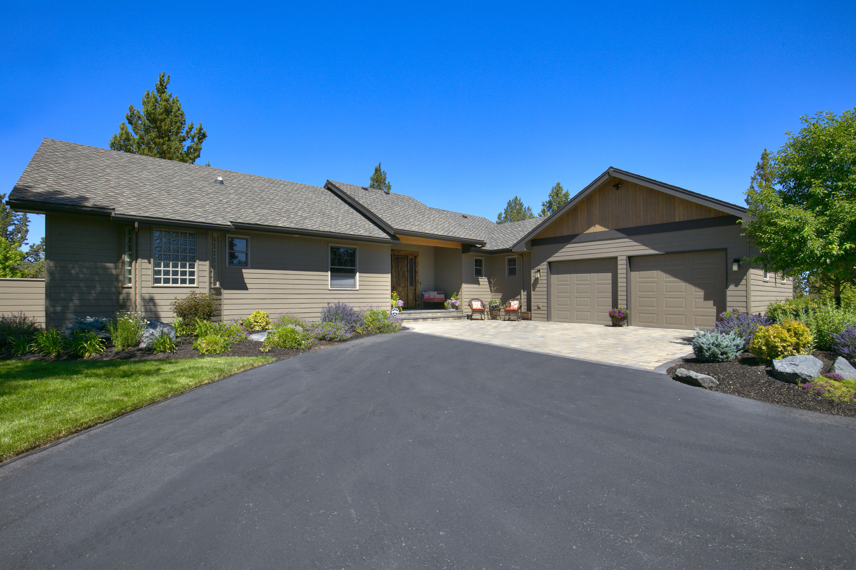 Beautiful Cascade Mountain Views from NW Style home on 5 acres in Tumalo. Custom home is 2824 sq ft, single level, 3 bedrooms, 3 bathrooms, great room with fireplace, chef's kitchen, pantry, breakfast bar, dining room, office, utility room and attached garage. Master suite with soaking tub, walk-in closet and tile shower. This home has quality finishes throughout. The covered deck opens to the paver patio, hot tub, fire pit, and landscaped yard to enjoy the outdoor living spaces and the views. Property includes 1280 sq ft shop with 2 bays, workbench, office, concrete floors and RV hookups. The setting is private on a quiet street, minutes from Bend or Tumalo.