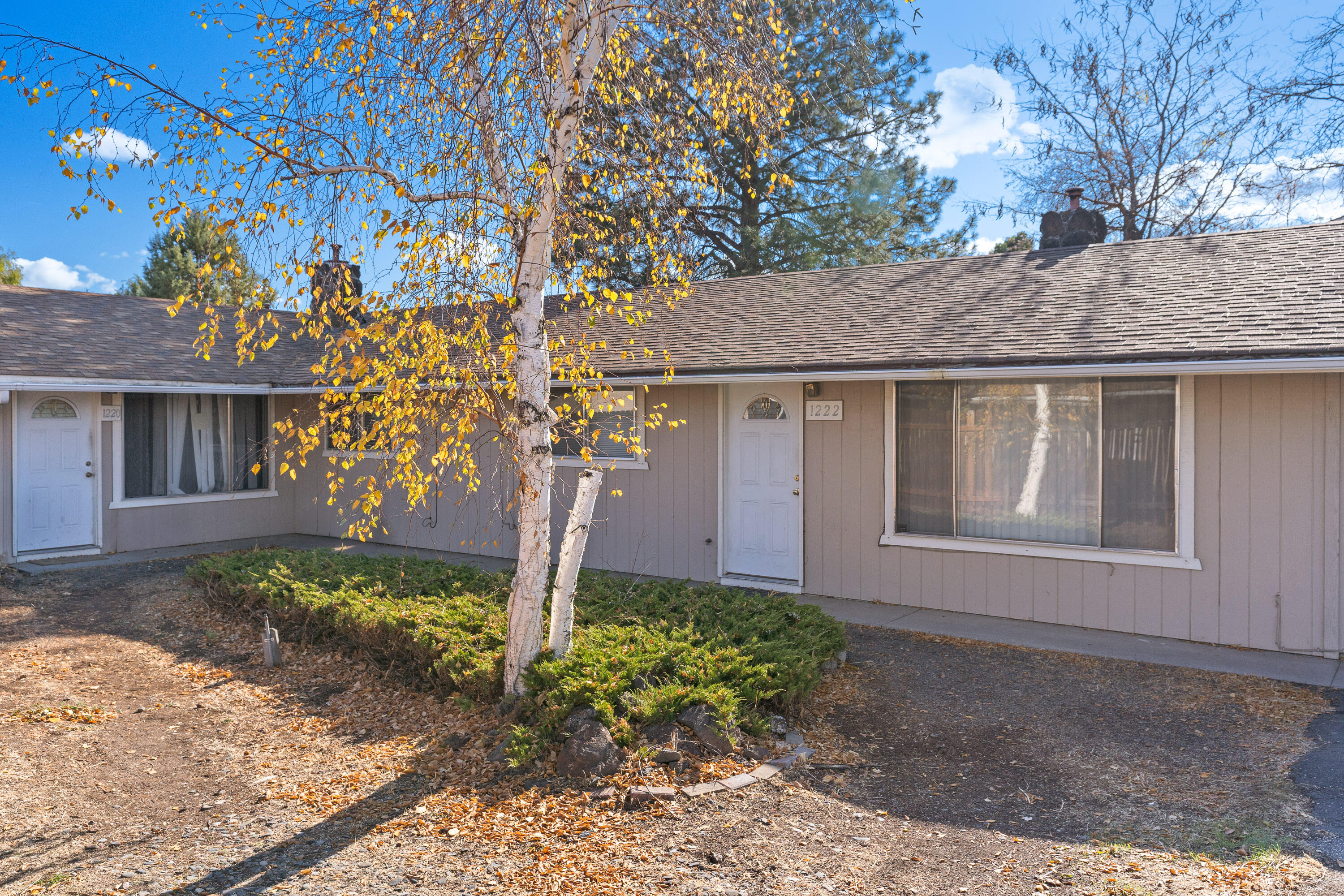 Prime Investment Opportunity! Two single-level duplexes with nearly 20 years of solid rental history, situated on a generous half-acre across two tax lots. Each duplex boasts a spacious 1,899 sq. ft. layout, featuring one 3-bedroom, 2-bath unit and one 2-bedroom, 1-bath unit, offering flexibility and appeal for a variety of tenants. Enjoy cozy fireplaces, open dining areas, functional kitchens, and convenient laundry/utility rooms in all units. Each unit also includes a fully fenced, sizable yard for outdoor enjoyment and a single-car garage. This is a rare chance to secure a stable income property in a great location. Don't miss out on this excellent investment!
