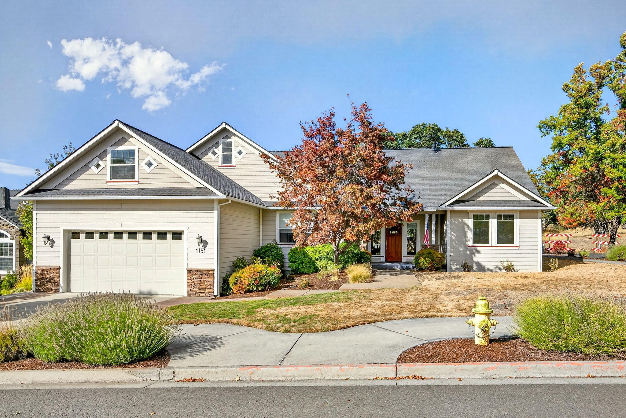 Situated on a desirable corner lot in the Eagle Point Golf Course community, this spacious home blends timeless design w/fantastic potential. Featuring wood & travertine floors, high ceilings, & large windows that fill the space w/natural light, it offers an inviting great room w/cozy gas fireplace, a generous formal dining room, and a breakfast nook off the well-appointed kitchen w/granite counters & cherry cabinetry. The primary suite is a true retreat w/coffered ceilings, a jetted soaking tub, walk-in double shower, & private deck, while two additional bedrooms and a full bath are thoughtfully positioned on the opposite side of the split floor plan. A large bonus room upstairs provides endless possibilities for a media room, home gym, or additional living space, & the oversized garage, central vacuum, & mature landscaping add convenience and charm. With lovely views of the Table Rock Mountains & plenty of room to personalize, this home is ready for its next chapter.