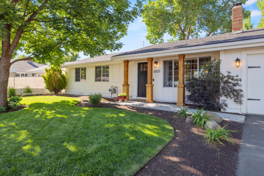 Gorgeous, fully remodeled 3bedroom/2bathroom home with impeccable attention to detail throughout!  Enjoy rich luxury plank vinyl floors, vaulted ceilings, and a stunning white kitchen featuring custom concrete countertops, an island and a seamless layout perfect for entertaining.  The spacious primary suite offers sliding barn doors that tuck away a walk-in closet, and an elegantly appointed primary bathroom with a beautifully tiled walk-in shower.  Step outside to a huge backyard with a stone patio and plenty of space to relax or play, with a sprinkler system in the front and the back for the beautiful landscaping.  Nothing is out of place in this move-in ready perfection!   One Seller holds an active Oregon real estate license.