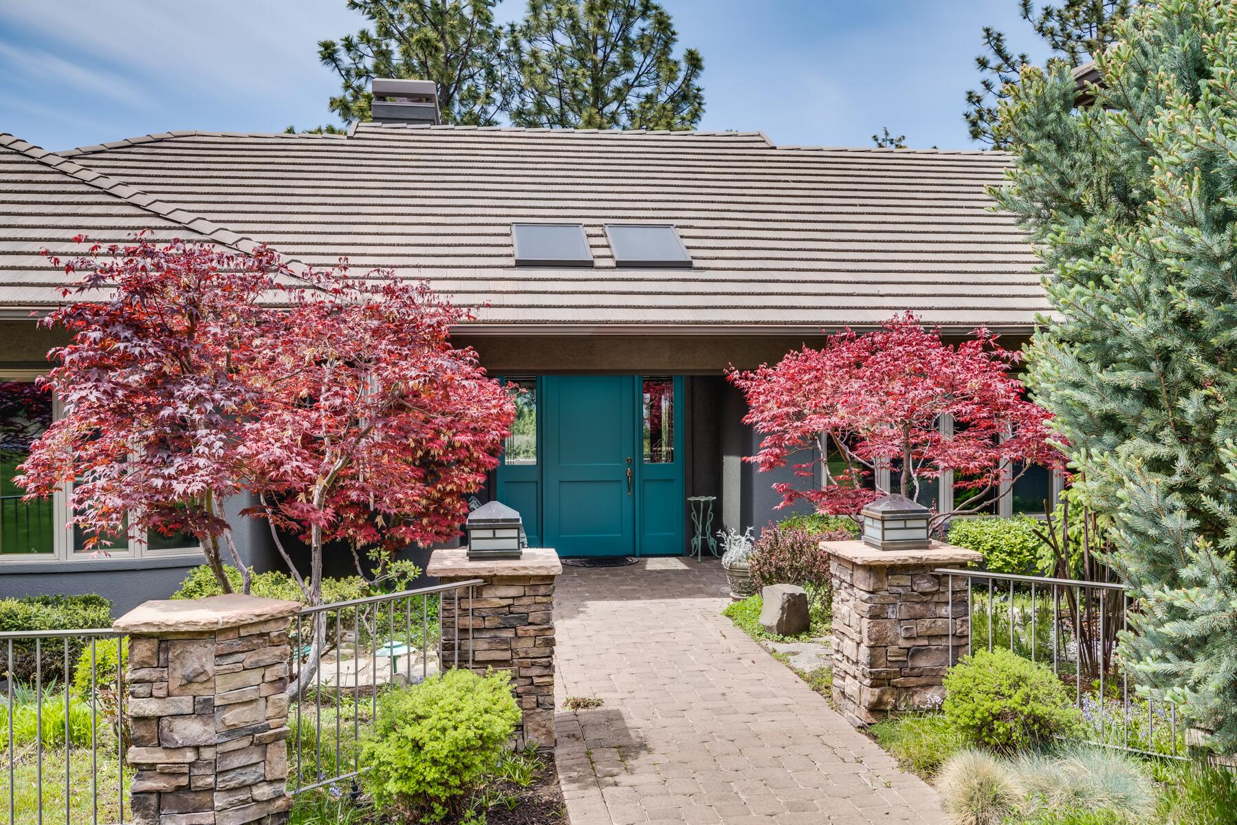 Million Dollar Views! This never before listed home is extra special because it is a true SINGLE level, with spectacular western mountain views on a premier lot on Awbrey Butte.  Red vine maples, a bubbling water feature and lots of color in the courtyard greets you at the door inviting you into a large foyer presenting you with ponderosa and mountain views. You will find more of the same as you glide from room to room. This home was supremely well-designed with a comfortable floor plan. Tons of amenities including cherry wood built-ins, radiant floor heat throughout, 2 fireplaces, 9 ft ceilings, central vac, hot tub, lots of windows, paver driveway, gorgeous landscaping, a spacious paver deck & much more. An RV garage is in addition to the beautiful 3 car garage . Surrounded by nature, wildlife & ever-changing colorful views of the sky and mtns equals a retreat you will never want to leave!  Only 10 min from downtown Bend and 5 minutes from Awbrey Glen golf this home is a must-buy!