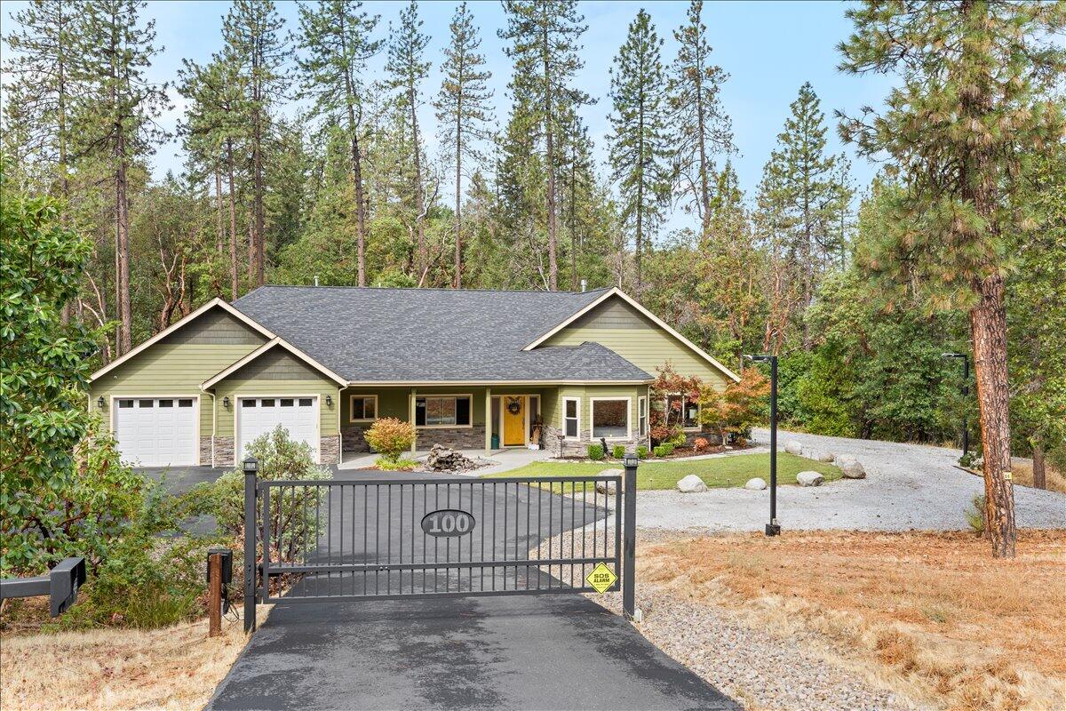 Welcome to your own private retreat in Paradise Vista! This stunning 2,740 sq ft home, built in 2014, sits on 5 beautifully maintained acres in an upscale neighborhood. Designed with comfort and lifestyle in mind, the home features vaulted ceilings, hardwood floors, jetted tub, granite
countertops, two fireplaces, a double oven, electric window coverings and an amazing garage with custom cabinetry throughout and much more. Outside amenities: RV hookups with dump station, security cameras, zip line towers, horseshoe pits, outdoor fire pits, a tranquil water feature, and miles of private hiking, walking, and ATV trails right on your property. Whether you're entertaining or simply relaxing, this property has it all. Don't miss your chance to own this incredible slice of paradise!