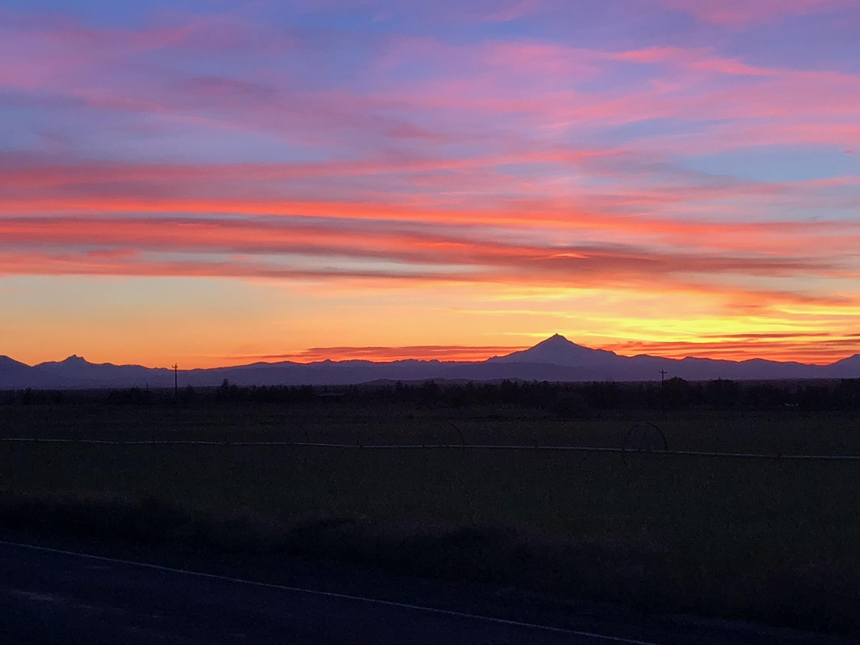 Something to cheer about! Great opportunity to make this home your own. Well built, 1980 home located in the desirable Red Cloud Ranch subdivision in Powell Butte. Easy access to Bend, Redmond, & Prineville. Nearly 5 acres of beautiful land with Cascade Mountain views. Large 36 x 48 pole building/ barn . Property is fenced for your animals. Has a lovely garden space as well. Home features 3 beds and 2 baths with 1,328 Sq. Ft of living space. New septic in 2020, windows have been replaced as well. Large oversized garage with separate heated work space. Come enjoy the incredible sunsets.