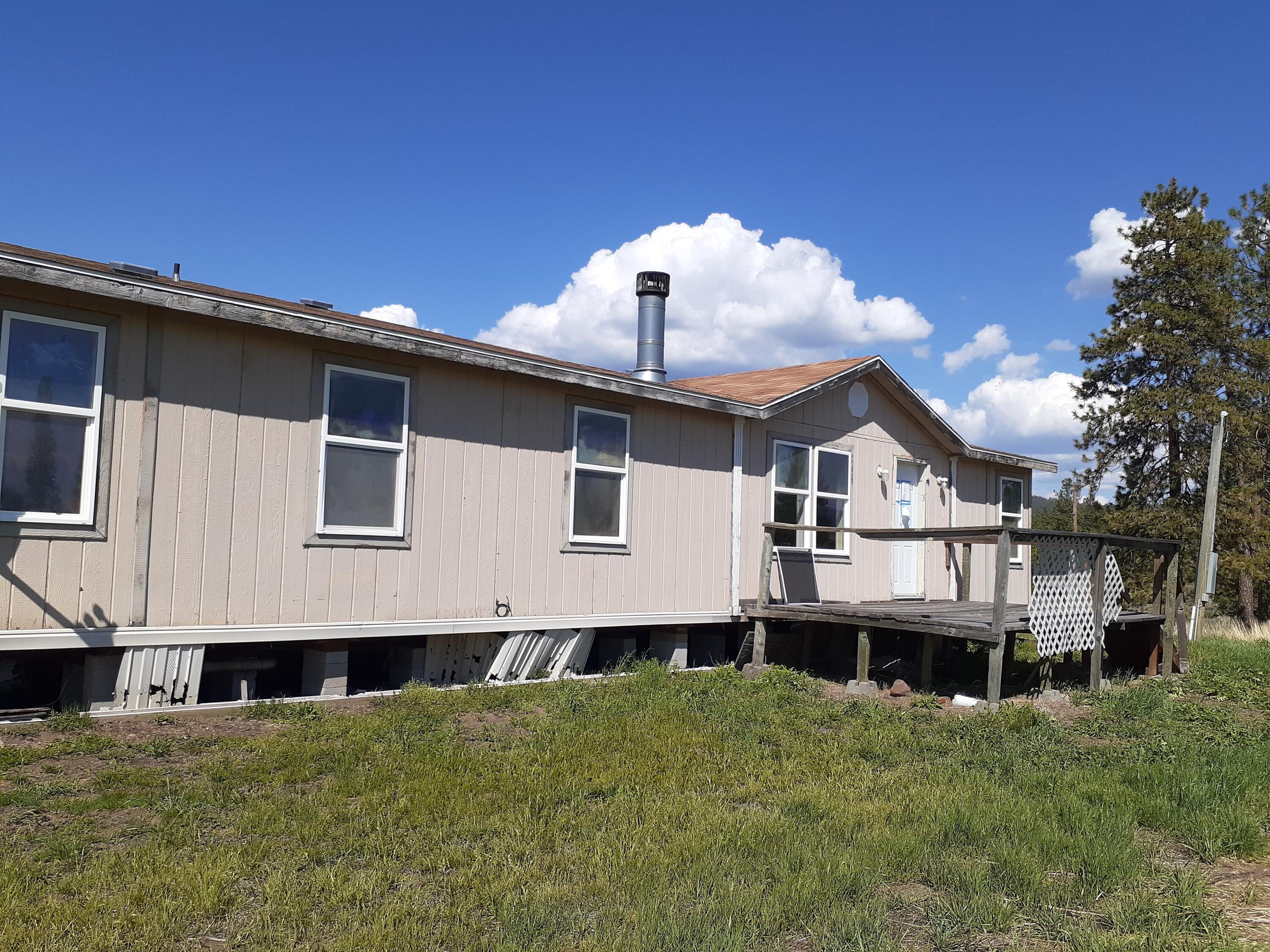 This home has great views of the area, located on a paved road and long driveway (away from the road).  With almost an acre, there is plenty of room to spread out!  The home is in need of TLC and repairs, ideal for a contractor or owner rehab and is priced very affordably!
WHEREAS the property is being sold ''as is'' and the Purchaser(s) is accepting the Property in its current physical condition and is also accepting the present status of all improvements and/or fixtures on the Property, including, but not limited to, any mobile homes or other fixtures or attachments to the Property.  Whereas Seller and Buyer are both ready to transact the closing, however the title to the mobile home is not available to Seller; and Whereas Seller will not provide a mobile home title, not take steps to obtain a mobile home title, and not take steps to de-title; and Whereas only the land will be insurable.