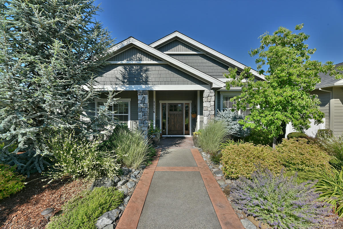 Stunning immaculate single level home located in the award winning Twin Creeks Subdivision! This custom Elite contemporary built home features upgrades throughout including 3 full bedrooms, 2 full baths with large master suite & bath w/ customized shower, vaulted ceilings, open kitchen w/ spacious 9' ceilings, glass tile backsplash, granite countertops, stainless steel appliances, 2 pantries, hardwood flooring, quality crafted cabinetry & trim package, custom rock gas fireplace w/ built ins, open living area, large two car garage, and more! This beautiful bright lovely home features professional mature low maintenance landscaping, patio w/ park like setting, all within walking distance to public parks, local schools and downtown Central Point!