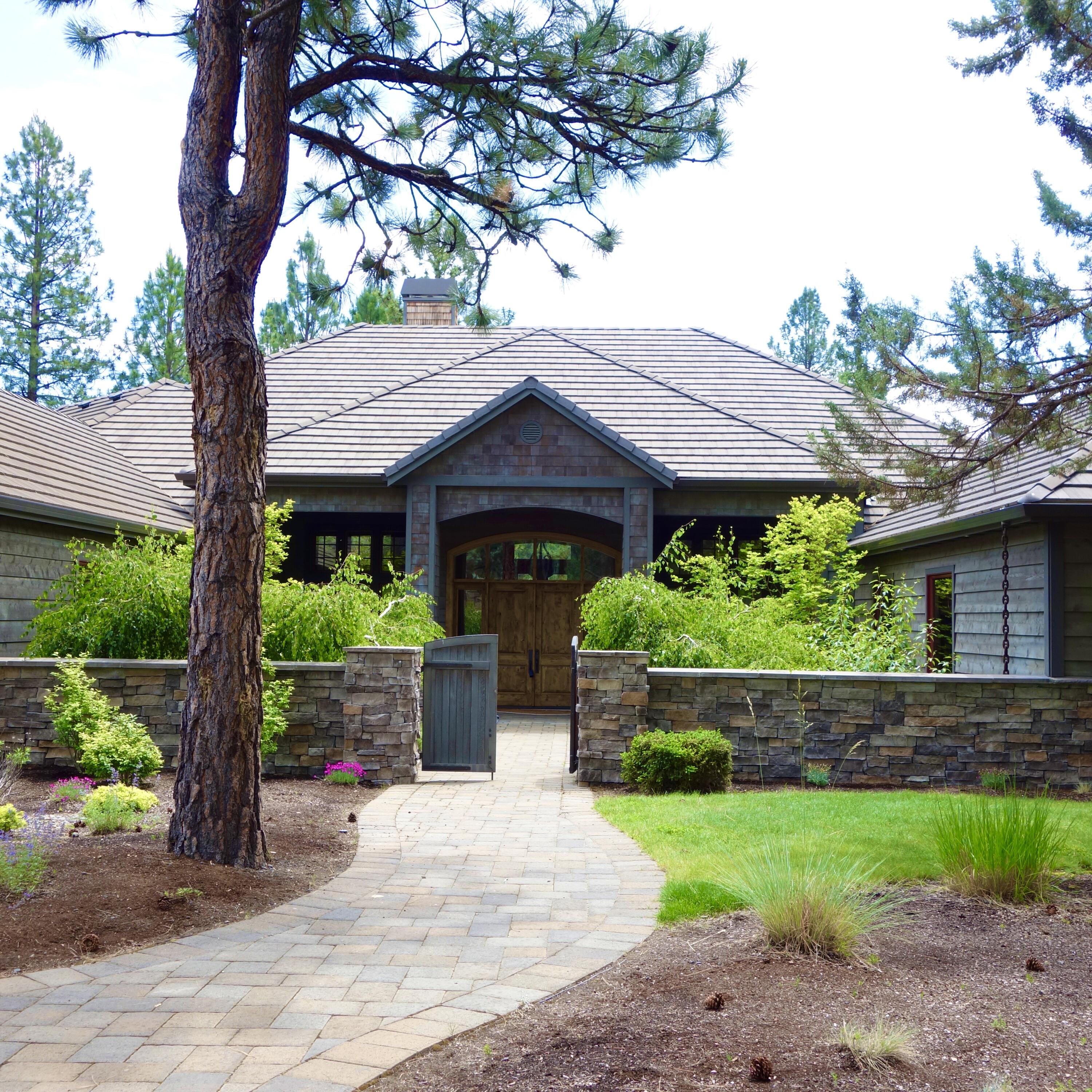 Stunning Lake views from this one story
home in Aspen Lakes Golf Estates!  Enjoy the Central Or lifestyle in this desirable neighborhood. High end Craftsmanship  accents in every room. A paver path leads to a courtyard with an attractive water feature, landscaped w/ irises, & a grand doorway. Inside the Great Rm greets you with an open floor plan, beautiful distressed Hickory wood floors, Alder cabinets, 16' ceilings & a wall of windows w/ Lake views.  Large gourmet Kitchen has a breakfast bar, high end appliances, granite counters & a large nearby pantry.  Home features 3 en-suite bedroom/baths (large 1st primary bedrm), plus 1/2 bath, a library w/ built in bookcases, 2nd office area, bonus rm, large utility rm with a bank of cabinets & an oversized 1,108 SF, 3 car garage. Seller paid $1,164/mo for property taxes & $147/mo for home insurance  in 2022., Dine on the large covered paver patio while the Trumpeter Swan swims by on the Lake! Not within striking distance of golf course