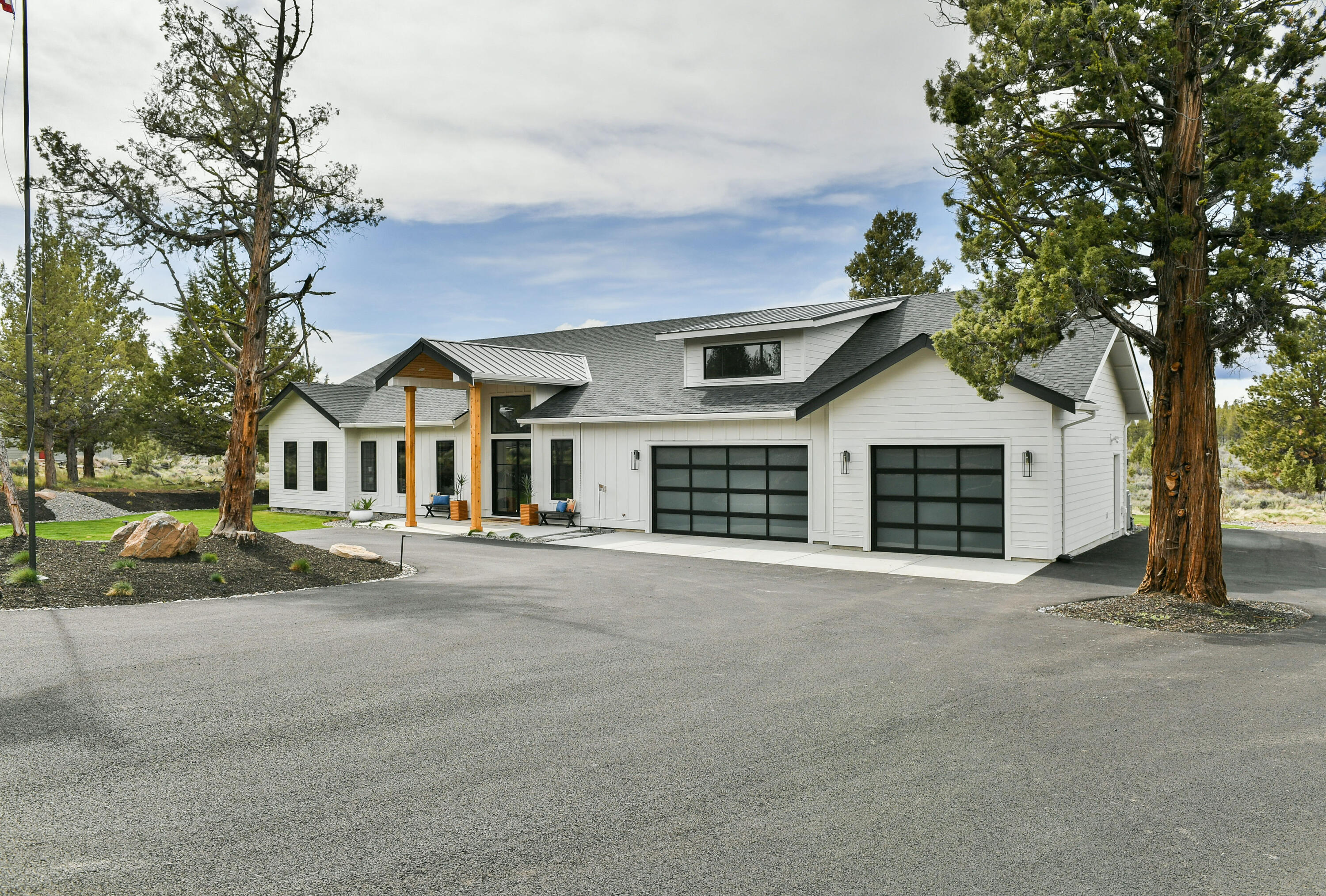 A true contemporary aesthetic and intentional site-specific design with breathtaking views of the Cascades High ceilings, open layout, beautifully finished with quartz surfaces, custom rift sawn white oak cabinetry and high-end appliances. Abundant natural light flows from the wraparound windows and doors into the central living space. The primary suite has a spa-like bath featuring heated floors, floor to ceiling porcelain tile walls, freestanding soaking tub, walk in shower, and giant walk-in closet. It encompasses the view of Black Butte and treetop view of Mt. Jefferson. The additional two bedrooms and office provide a highly functional layout. This home is luxurious living, perfect for entertaining inside with its open floor plan & top of the line finishes; or outside with expansive covered living, sitting, or dining area. 3-car garage includes a separate storage space & ample project space.  Add your  imagination to the approx  800 sq. ft. flex space above the garage.
