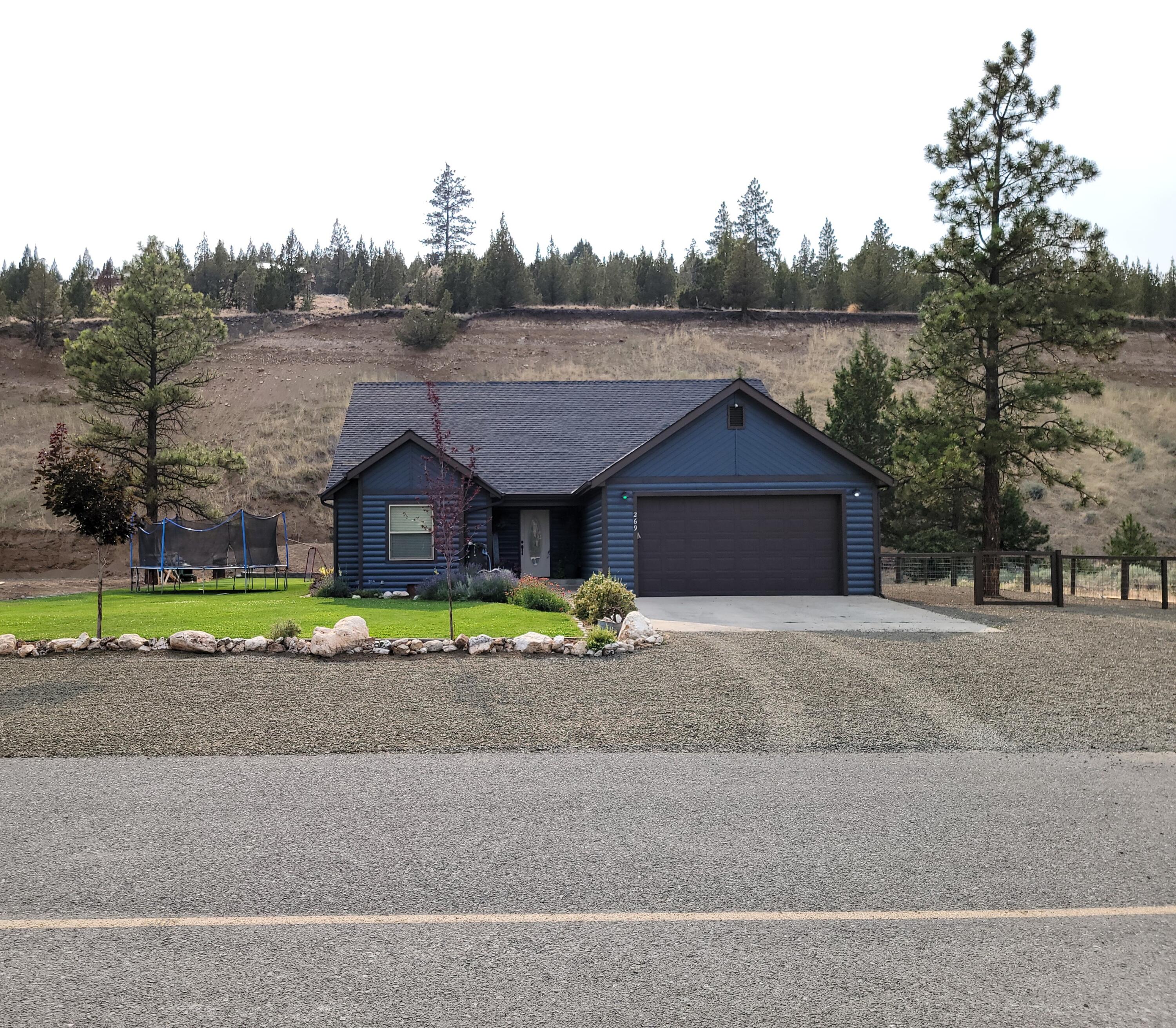 Beautiful custom home setting in a nice subdivision - incredible views. 4 bedroom 2 bath 1802sqft home built in 2007 on large lot 0.75 of an acre.Granite countertops, tile floors, open floor plan,knotty alder cabinets,island,21X22 garage,fenced dog run,large yard with underground sprinklers,landscaping, freshly painted exterior, new heatpump 2020. This is a beautiful home with many custom upgrades througout.Pride of ownership inside and out.