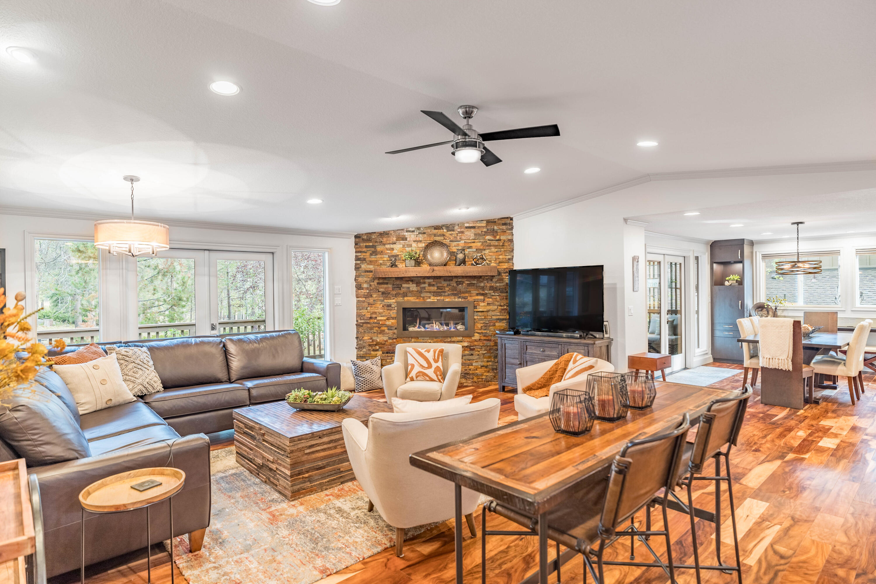 Experience modern luxury in this stunning 4 bedroom, 3.5 baths Sunriver home! High-end renovation from top to bottom, nestled in a peaceful cul-de-sac with a serene common area behind. Relax and unwind on the expanded back deck, embraced by privacy & accessed through one of the 3 French doors bringing the outside in. Indoors, a gas corner fireplace invites warmth, while the gourmet kitchen beckons with granite counters, stainless-steel appliances, and an inviting eating bar. Entertain in the chic bar room with granite surrounds, wine refrigerator, and floating shelves. The main-level Primary Suite exudes luxury, boasting a tiled shower and a soothing rain shower head. Upstairs, two guest bedrooms share a full bath, while downstairs, a 4th bedroom suite offers its own bath & can be used as a flex space if you prefer. Acacia floors, HVAC, and new windows exemplify the thoughtful upgrades. It's all new, it's all here - don't miss your chance to call this home!
