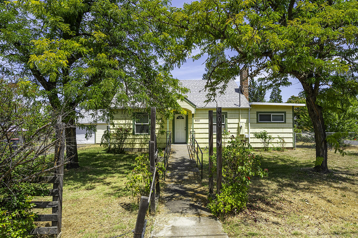 Location, location, location! Right across from Phoenix High School, this charming property features 3 bedrooms (plus an office that can be used as an additional bedroom), 1 bathroom, 1560 sq ft, spacious 0.42 acre lot (lot can possibly be split and sold off separately), updated kitchen w/ large island, granite countertops, and ample cabinetry, detached single car garage, newer interior paint (except the bathroom), shower/tub combo in bathroom, refinished hardwood flooring, woodburning fireplace, & much more! Perfect opportunity for an investor looking to live on the property while splitting the lot and building their dream home or for anyone looking to be close to everything Phoenix has to offer! Buyer to perform their own due diligence regarding possible lot split and development potential. This one won't last long on the market so contact your agent today for a personal tour, before it's too late!