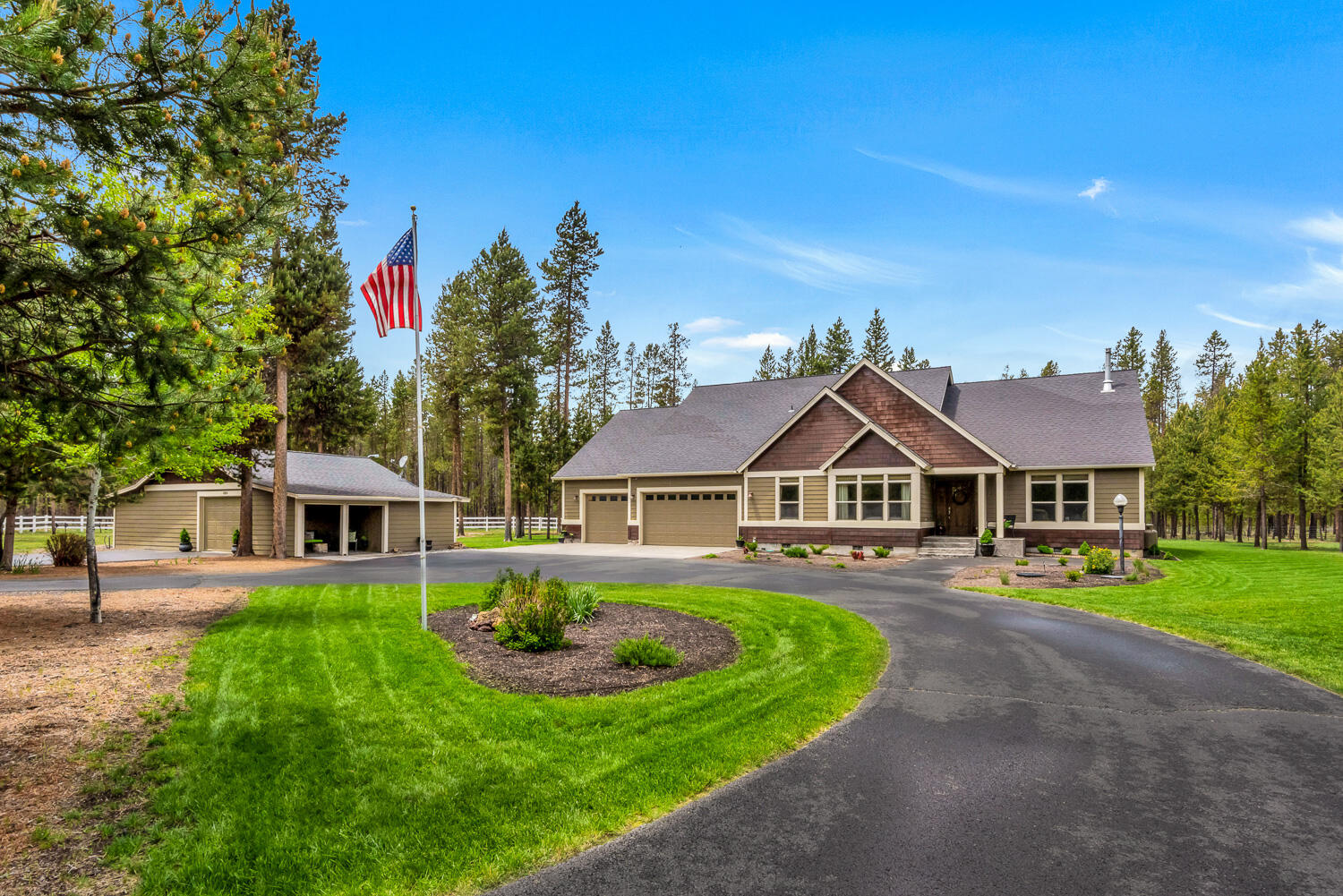 Legendary custom home on acreage in the heart of outdoor Deschutes River & Mt. Bachelor recreation wonderland! This energy efficient main level home boasts room for everyone including 2 master suites, a 3 car garage w/ attic lift, and shop for storage and tooling on your future project or vehicle. Home is designed around the kitchen (w/ island bar and premium granite countertops) and great room appointed w/ full rock surround propane fireplace. Don't forget the easy to access, expansive den/office/media room.  Great room style with bonus room currently a bunk room, AND a den/office/game room. Oversize triple garage. Large outbuilding w/ single bay garage, two stalls and plenty of room for toys & storage. With great access to HWY 97 and a few minutes to Sunriver; you are near a multitude of natural lakes, rivers, and the Cascade Mountains. Hiking, biking, boating, lazy float trips, hunting, fishing, skiing. Don't miss the best life to live at Grimm Road - it won't last long!