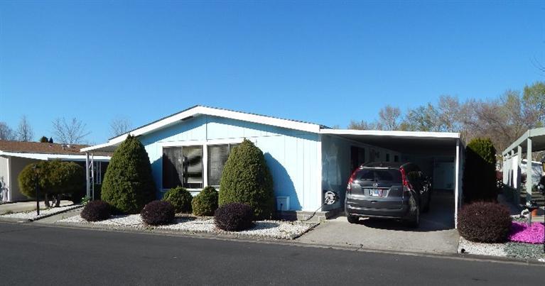 DO A DOUBLE TAKE! This 1990 Fuqua 2 Bdrm/2 Ba is located in popular Mt View Estates, a 55+ park in Talent. The vaulted ceilings give a sense of spaciousness to this step saving, open floor plan. The master suite, situated for privacy, has a walk-in closet & step-in shower. The second bedroom is roomy & has an adjacent bathroom that can also be accessed from the laundry room. The kitchen skylight floods the room with sunlight. A center island in the kitchen keeps it open to the bay windowed family room. You'll find more storage than you'll ever use from the kitchen to the laundry room to the carpeted workshop with workbench. The long carport provides plenty of parking. Enjoy summer evenings relaxing on the covered front patio. Recreational facilities, friendly neighbors & the peace & quiet of a gated community.