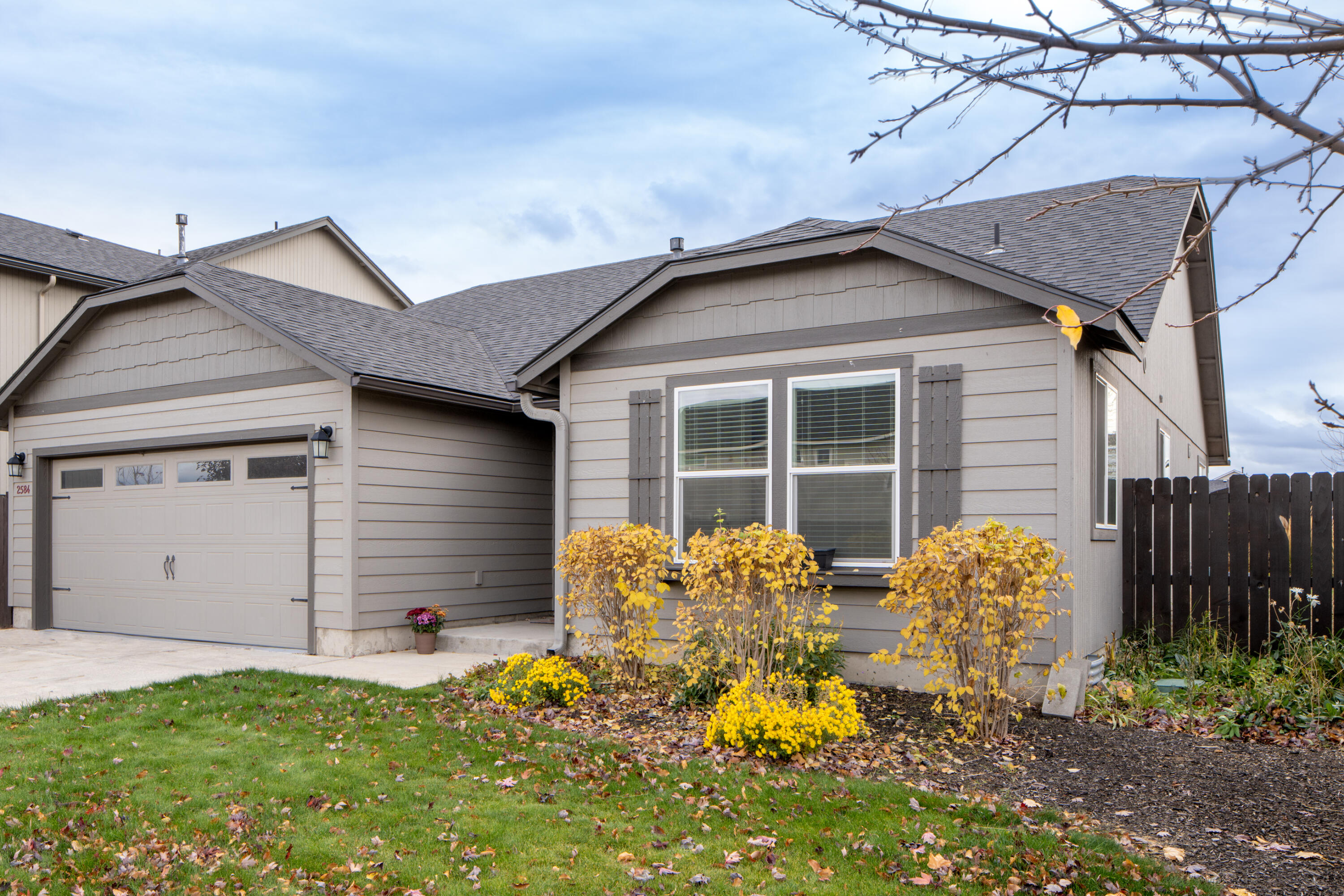 This lovely single-story home is situated in a fabulous neighborhood, offering an inviting open floor plan that seamlessly connects the kitchen to the great room, which features a cozy gas fireplace. The separate primary suite provides a tranquil retreat and includes two spacious walk-in closets as well as an en-suite bathroom complete with dual vanity sinks for added convenience. Additionally, there is a guest room that boasts elegant French doors, making it perfect for use as either a comfortable bedroom or a functional office space. The exterior of the home is enhanced by a fully fenced and beautifully landscaped yard, providing a private oasis for relaxation or entertaining. With its thoughtful design and desirable features, this property presents an ideal living environment for those seeking both comfort and style in their next home.