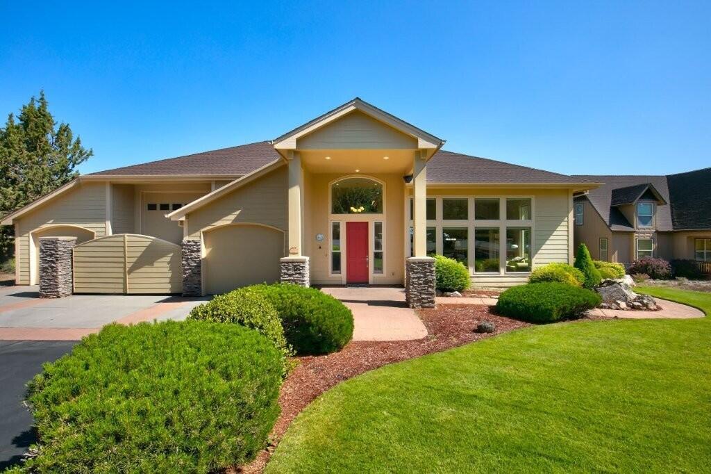 Setting itself apart as one of the few properties in Eagle Crest with an RV bay, this well-maintained custom-built Sunterra home has had one owner. Enjoy the great room with its 12 ft ceilings, abundance of windows, surround sound & wet bar. The open kitchen features a breakfast bar, two pantries, a warming drawer & plenty of counter space & storage. A large primary bedroom has a walk-in closet, double sinks & an oversized walk-in tile shower. Secondary bedrooms share a jack & jill bathroom and all bedrooms have their own outside door & patio. Some of the features of this energy efficient home are radiant floor heat, an air filtration system & recirculating hot water. The garage is a dream at 1317 sq.ft. with three doors/bays, one that is a 41 ft deep RV bay with a 15 ft ceiling, 30 amp hookup & water plus a utility sink, two man doors to the outside and a finished heated storage area above with a pull down ladder and a big side door. Common area & walking trails out your back door!