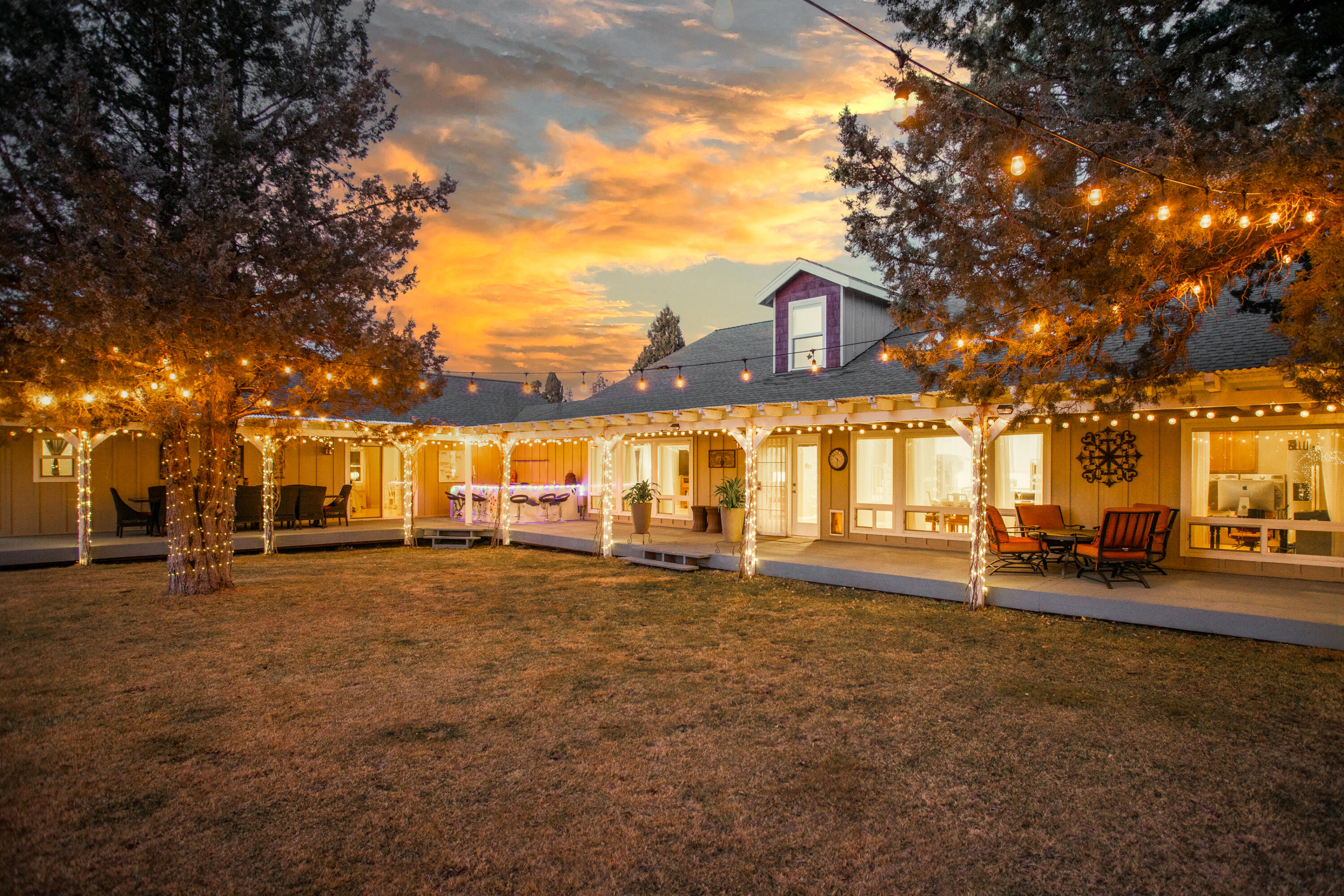 This extraordinary rural retreat, located just minutes East of Bend, is now being offered for sale! The 9.9 acre property provides a peaceful oasis to its owners and guests. Equipped with a spacious backyard, an outdoor bar, and an expansive wood deck: this property is an entertainers dream! Outside, the home is surrounded by gorgeous juniper trees that light up at night with an extensive light feature. This listing offers a beautifully sunlit living space with 3 skylights and an open floor plan of 4,266 sq ft. The home provides 2 primary suites on the main level, each offering outdoor and patio access. The
beautifully remodeled kitchen is located centrally between the two primary bedrooms. Walking upstairs, you will find 2 additional bedrooms, a full bath, and a window nook for reading or office needs. The property features a 400 sq ft guest cottage, a custom-built chicken coop, concrete dance floor, gazebo, water feature, and 3 storage sheds. Come experience the serenity of East Bend