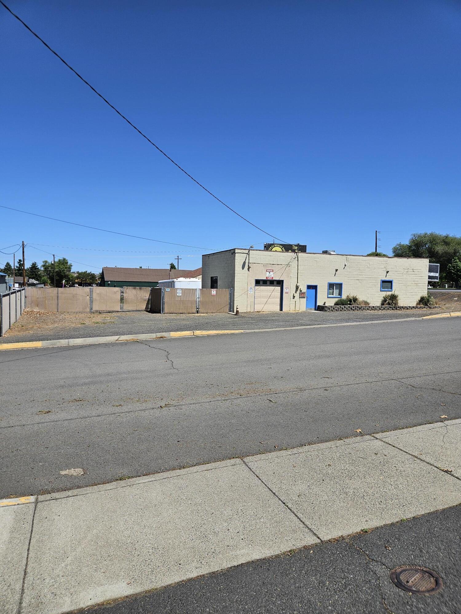 Great location, right on Highway 97 going South out of Madras.  Nice fencing to enclose much of the lot.  Useful open space with an overhead door.  Perfect for retail or a shop.  The zoning is C3 and allows both commercial and residential.  The billboard lease does not   convey with the sale and is a separate account with the assessor's office.   Building sold as is.