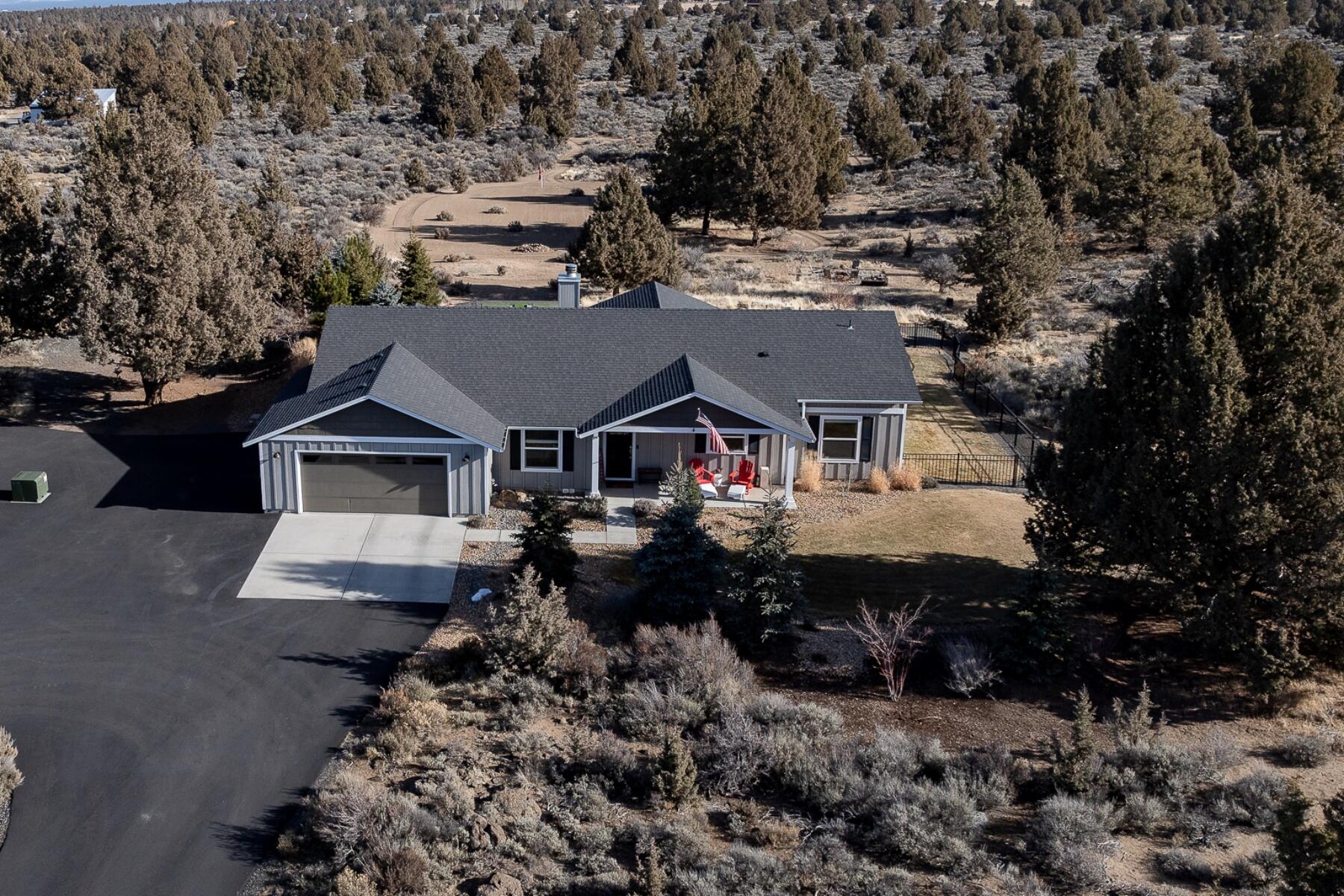 Privacy takes the Center Stage on this stunning 9.95 acre property on Bend's Eastside of town. A
classic 2,062 Square Foot Craftsman Single Level provides ideal living space that fits a variety of
homebuyers. 4 Bedrooms and 2 Full Bathrooms, including a spacious Primary Suite provide a flexible floorplan. Open Concept Living Space and layout. The backyard features an expanded paver patio,
covered spaces, a water feature and serene landscaping. Just East of the backyard are acres of
natural High Desert on your property. Property is bordered to the East and South by undeveloped Bend Parks & Rec Land. Located minutes from town, but a world away with peace and privacy.