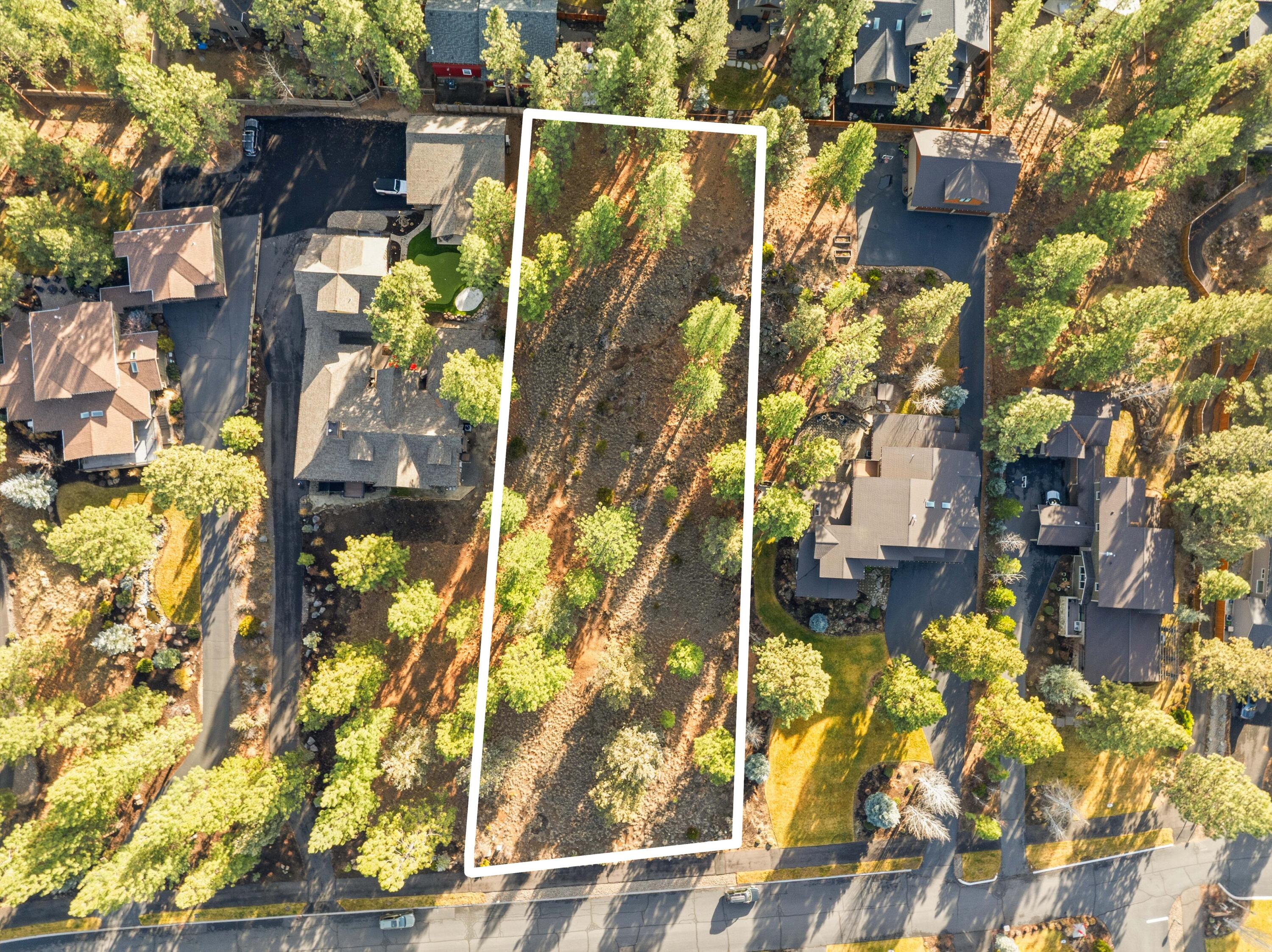 One of the last chances to build in Parks at Broken Top—only five homesites remain in this highly desirable NW Bend community. This 0.82-acre, gently sloping, treed lot offers an exceptional setting for a custom home surrounded by natural beauty. Enjoy an active Central Oregon lifestyle with paved walking paths, access to nearby mountain biking and running trails, neighborhood parks, and the Parks Community Pool. Conveniently close to Westside shops and restaurants, and just minutes from Mt. Bachelor and the Cascade Lakes, this premier homesite blends privacy, recreation, and everyday convenience. A rare opportunity to create your dream home in one of Bend's most sought-after neighborhoods.