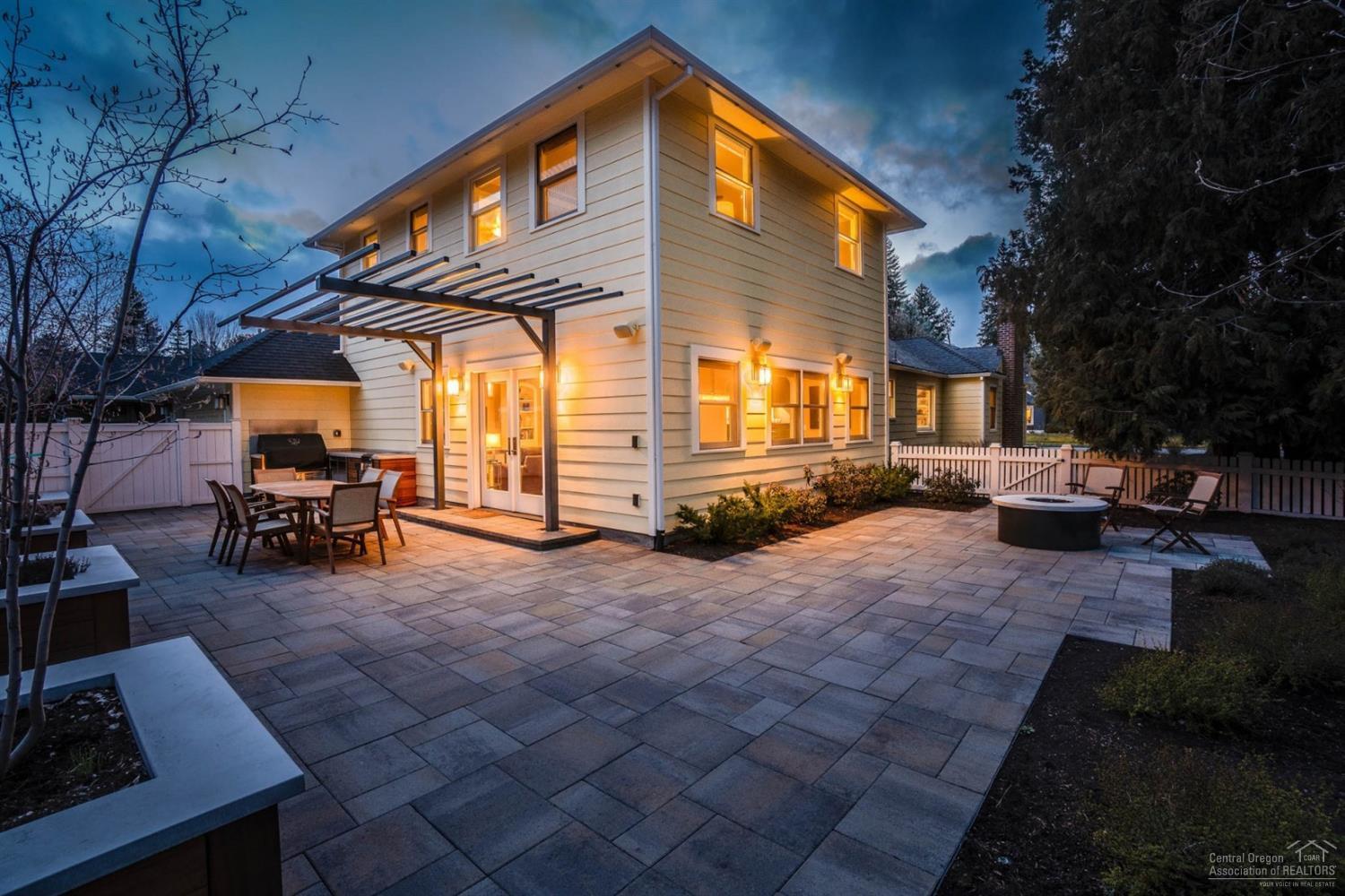This stunning home in Bend's Drake Park Historic District is a must see. Situated on a large corner lot, home features custom high end finishes, beautiful furniture package and updates throughout. Newly renovated gourmet kitchen, central vac, Sonos wireless home sound system, beautifully landscaped yard with private hot tub, gas fire pit and old growth trees. Downstairs boasts wine cellar, full bar; including custom dishwasher & fridge, home gym or 4th bedroom, pool table and more. Ideal for entertaining.