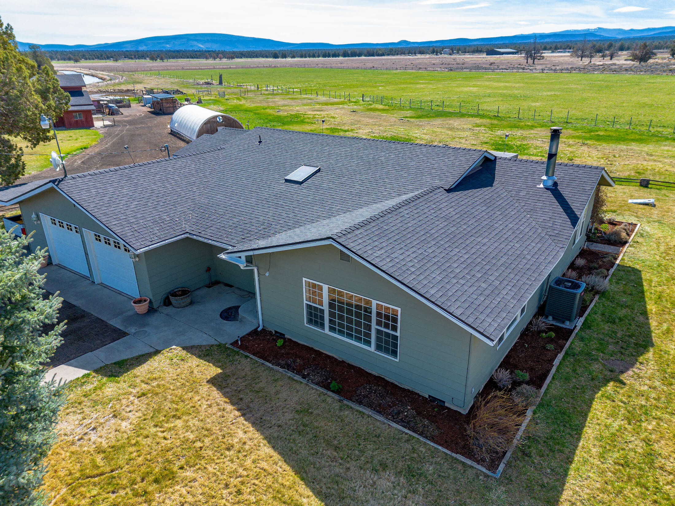 Farm near the city of Bend with breathtaking panoramic views! Excellent farm location to grow crops/vegetables and raise animals - your very own oasis from the hustle and bustle of life. Cows or horses? Pastures and hay fields available to be self-sufficient. Plus 4 stall barn and large greenhouse! This blank canvas offers plenty of opportunities to make it your own inside and out. Roomy floor plan includes newer interior updating w/ spacious sunroom accessible from both the kitchen and master bedroom.  Only 15 minutes to Costco, and in Bend School District. Access to Badlands at the end of Obernolte with COI & BLM across Dodds Road. Don't forget the new roof on house and barn, HVAC and heat pump, updated flooring and bathrooms. Pull into the driveway and make this property yours today!