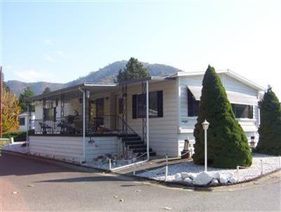 Very well maintained home in 55 and older park located in downtown Rogue River. Close to shopping and all city services. 2 bedrooms, 2 bath, large shop/storage, easy care landscaping. $267 per month space rent includes sewer, water, garbage.