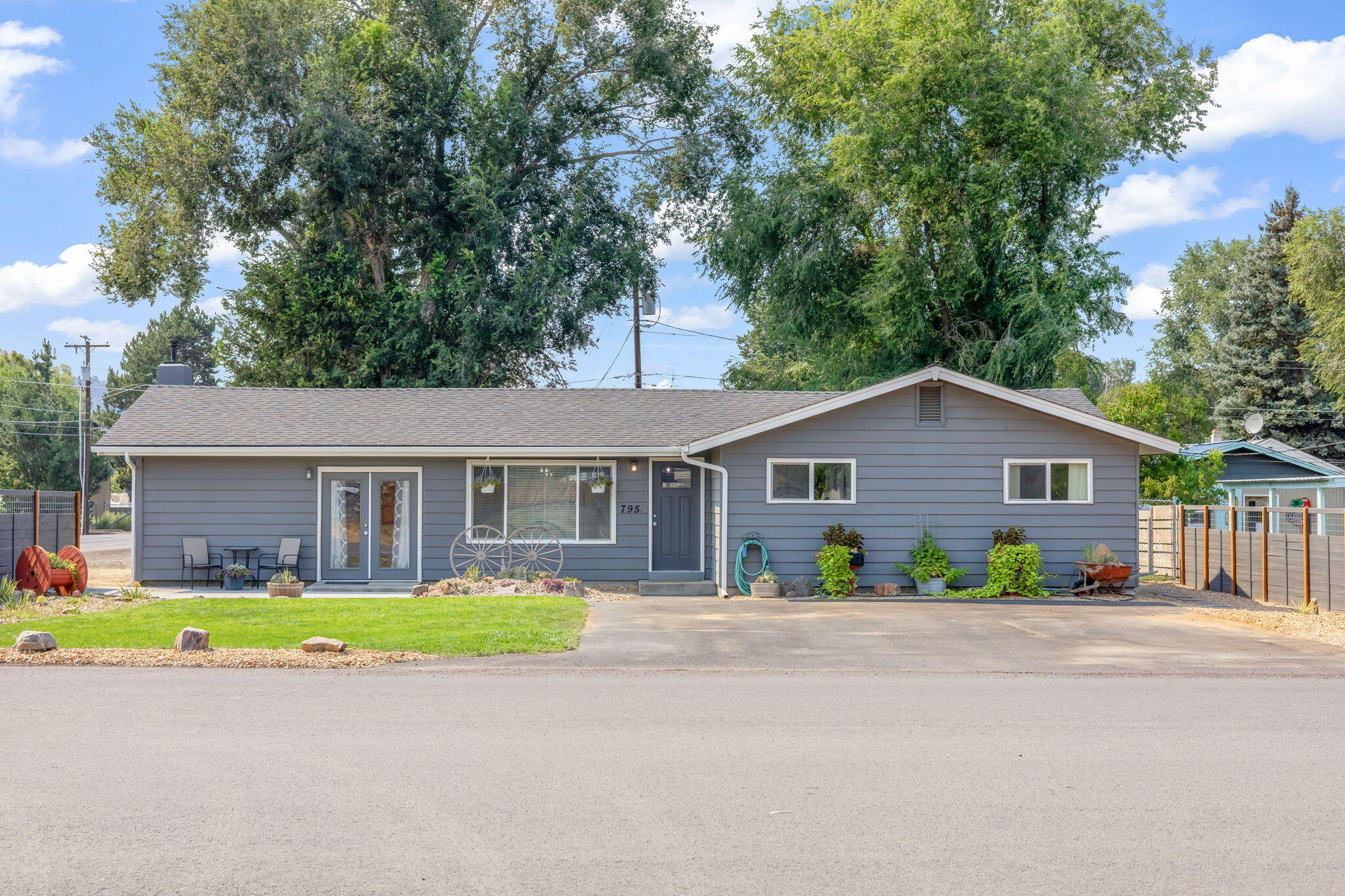 This fully updated 3-bedroom, 1-bath home sits on a spacious .24-acre corner lot & has everything you need! Inside, you'll find brand-new flooring throughout, fresh
paint & lighting. The kitchen is completely redone with solid surface counters, a huge island with architectural wood beam, updated appliances, its perfect for cooking,
hosting, or hanging out. Large bonus room with pellet stove is currently being used as a 4th bedroom/primary suite, could easily be used as a family room or game
room. The bathroom is fully updated with brand new tiled shower & double vanity. Outside, there's new fencing, gutters & fresh landscaping. The property is fenced,
with RV parking & hookups, super convenient if you've got a camper or guests visiting. There's also alley access to the backyard & a detached outbuilding that has
tons of possibilities to be turned into an ADU or workshop. This home is totally move-in ready & has space to make it your own. Come see all if has to offer!