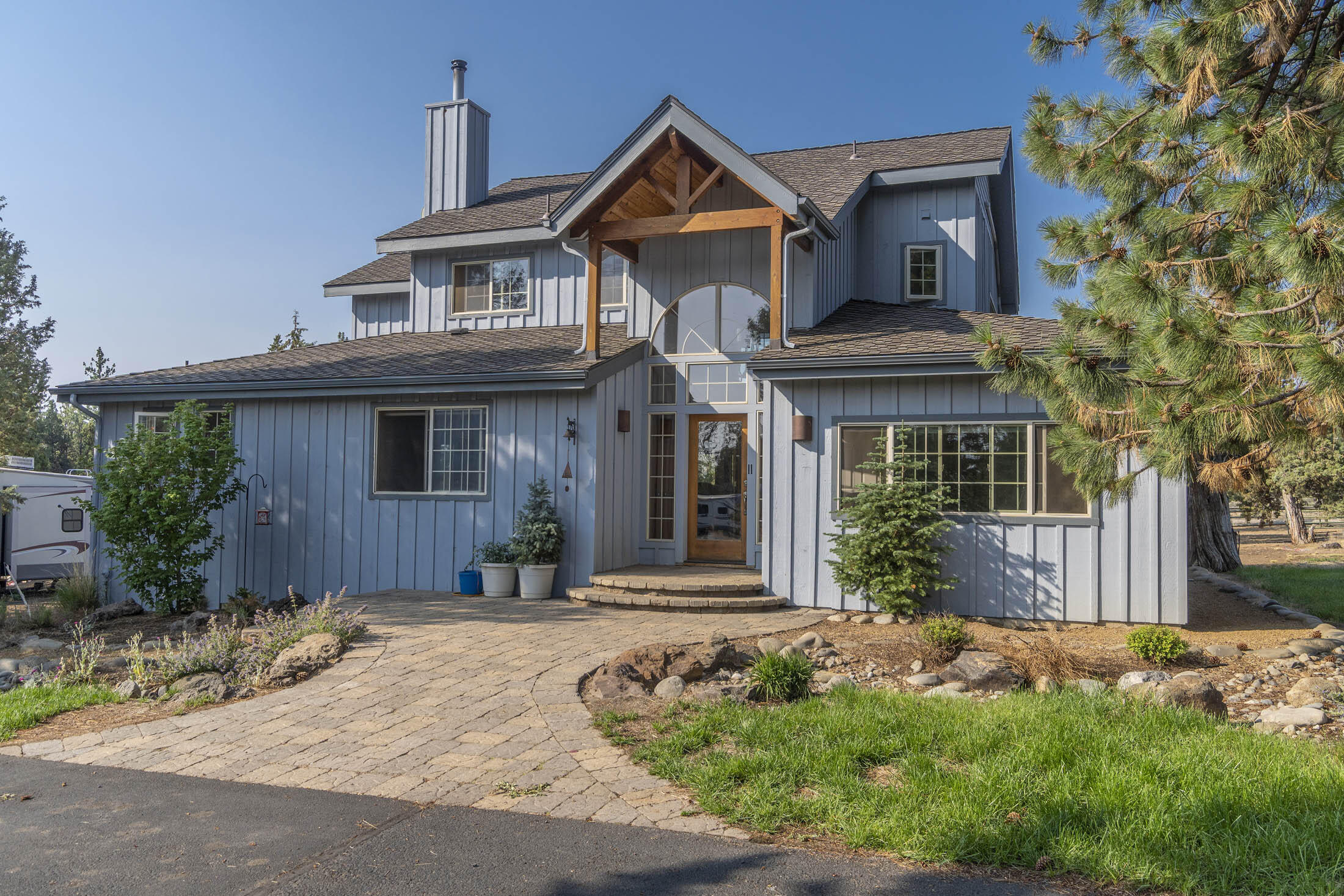 Rare 8.5 acre horse property only 3 miles from downtown Sisters with stunning Mountain Views! This fabulous light-filled 2728 sq. ft. home features a reverse living open floor plan.  Upstairs you will find a spacious kitchen with custom cabinets, granite countertops and a large kitchen island that opens up to the living room and cozy fireplace. Upstairs is also the dining area, an office and half bath. Downstairs you will find a large living area with a beautiful rock fireplace, lower level primary suite with doors that lead out to the deck which boasts 1000sq. feet of newer trex decking, This property offers a large barn with 3 horse stalls, horse wash rack, and tack room,  You will love the three bay doors for easy access, 5 automatic water stations, hay storage and a chicken coop!  There is a massive hobby barn/shop with solar panels, bathroom, washer dryer hookups and a studio apartment above with mountain views.  Come see for yourself everything that this property has to offer