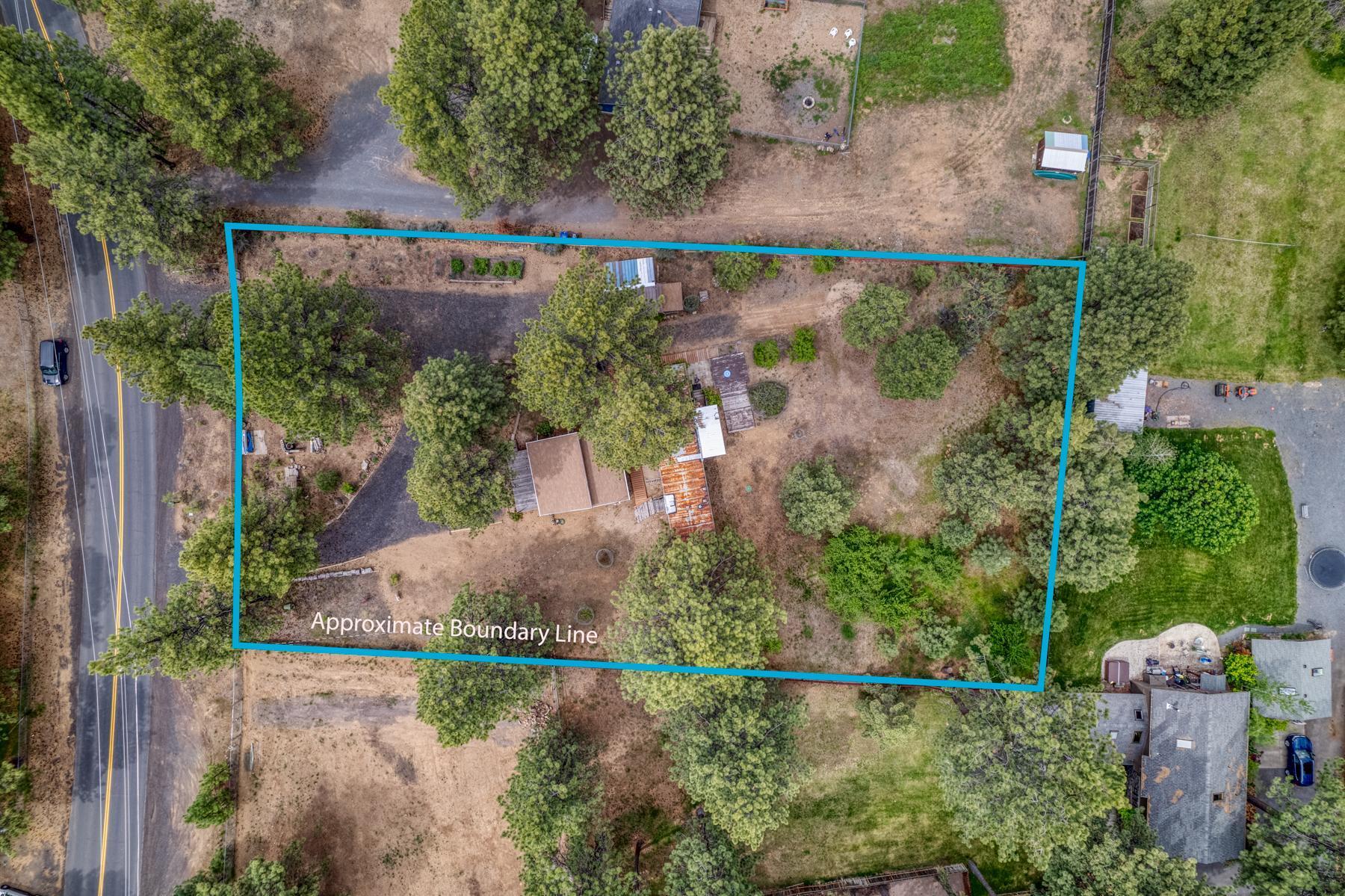 Fully fenced, level lot on paved road in Deschutes Riverwoods with 1976 single-wide manufactured home, 576 sq. ft. unfinished structure, and storage shed. There are a lot of possibilities! You can live in manufactured home while building, finish or expand the unfinished structure, or replace older manufactured home with new one. The manufactured home is clean and has a newer electric furnace. Property has a standard septic system that was replaced in 2011 with concrete tank and new leach lines. Property is on community water.