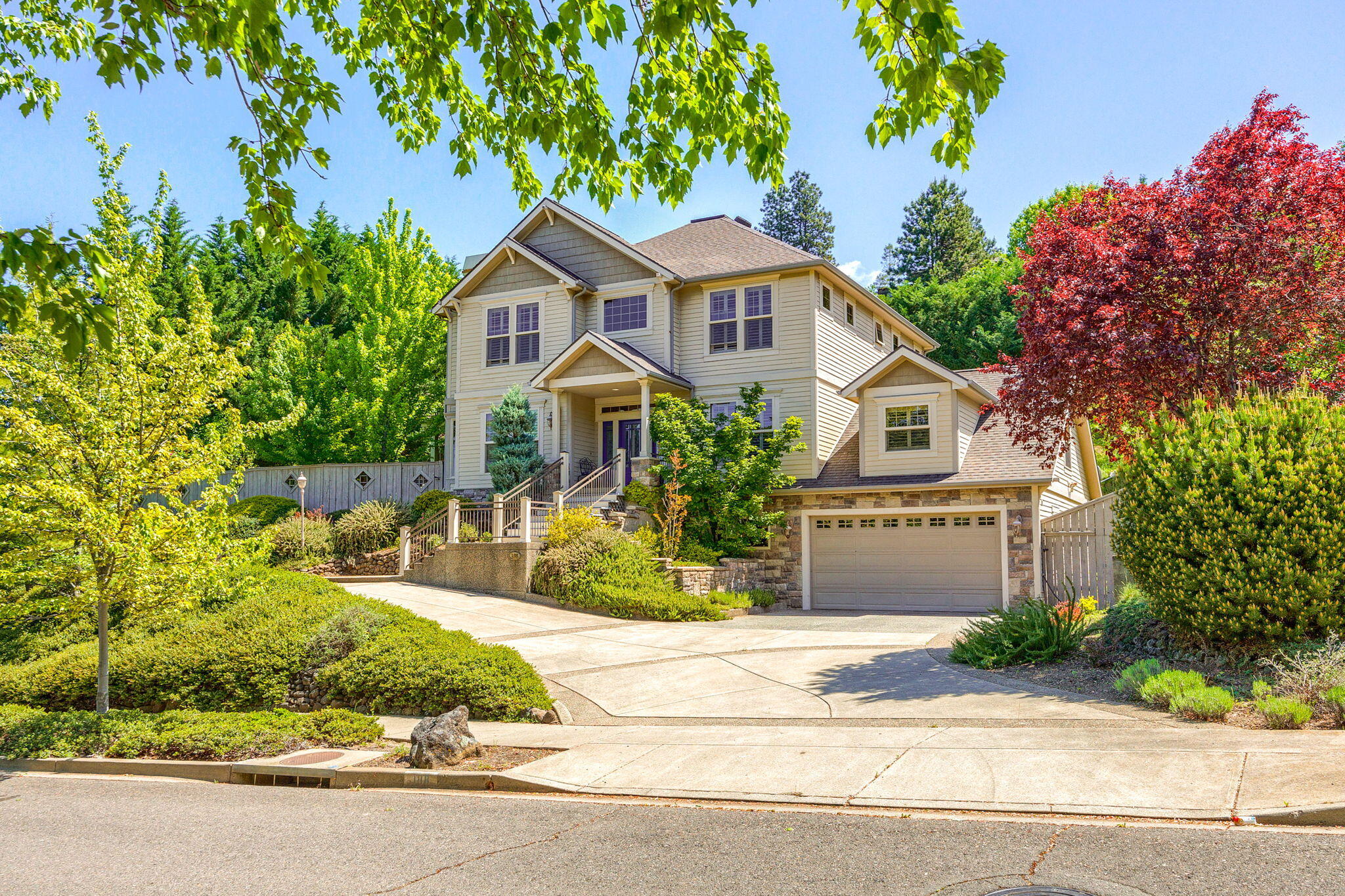 Welcome to this impeccably maintained home in Eastfield, one of Ashland's most desirable neighborhoods. Offering 3,444 sq ft of living space, this home features 9 ft ceilings and American Cherry hardwood flooring on the main floor, a dedicated office/den, lovey ¾ bath, beautiful living room w/ gas FP and white window shutters. The kitchen w/granite slab countertops, extensive cabinetry, and eating bar is adjacent to a cozy family space that leads to a sizable bonus room or perfect 4th bedroom option. The second floor includes a primary ensuite w/ a private view deck, jetted tub, & separate walk-in shower, 2-additional bedrooms & the 3rd bath. Lower-level includes an extra-deep 2-car garage w/large workshop, partial basement w/ a temperature-controlled 1000-bottle wine cellar, & a silent butler for easy grocery transport. The fenced half-acre lot is beautifully landscaped w/ an automatic watering system. HOA amenities include a community tennis court and easy access to hiking trails.