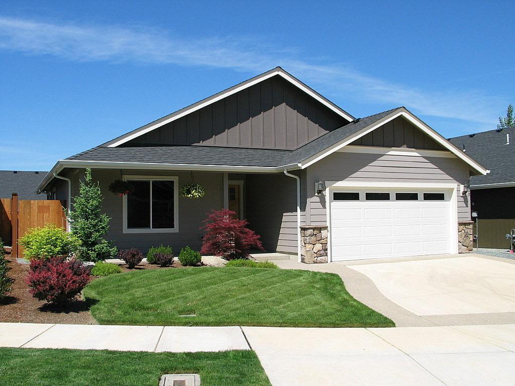 Almost better than new! You'll be hard pressed to find a better floorplan here in beautiful, new Summerfield Subdivision. Perfect kitchen layout with large peninsula breakfast bar, quality stainless steel appliances with fridge included, attractive wood range hood and a walk-in pantry plus a comfortable dining area. Custom wood cabinets and sparkling granite counters throughout. Gorgeous hardwood floors in kitchen, dining and entry. Carpets in terrific shape and just professionally cleaned. The generous master bedroom features an ample walk-in closet and master bath with dual sinks and separate water closet. Spacious laundry room with loads of storage and newer washer/dryer included. Entertain out back on your large, north-facing, covered patio with more lawn than most in the area. Just a few minutes to several parks including Schroeder park on the majestic Rogue River known for its phenomenal Chinook Salmon and Steelhead fishing. High Speed Cable Broadband internet available