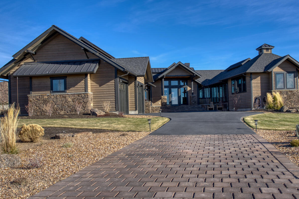 Light and bright one-level home situated on an expansive home site features Cascade Mountain views and a lovely outdoor living space. As you enter the home, you are welcomed into an open living space with vaulted ceilings, large windows, gorgeous hardwood floors and a floor to ceiling stone fireplace. The farmhouse style kitchen features quartz countertops and island, beautiful custom cabinets, a large farm sink and a prep sink at the island. The master suite is the perfect oasis to relax in with a soaking tub in the master bath, large walk in closet with custom cabinetry. Laundry will be enjoyable with this utility room and the extra counters and storage area. Two additional bedrooms, full bathroom and half bathroom finish out the home. Other features are the central vacuum hide-a-hose system with garage vacuum, oversized three car finished garage with epoxy floors and enclosed HVAC.
