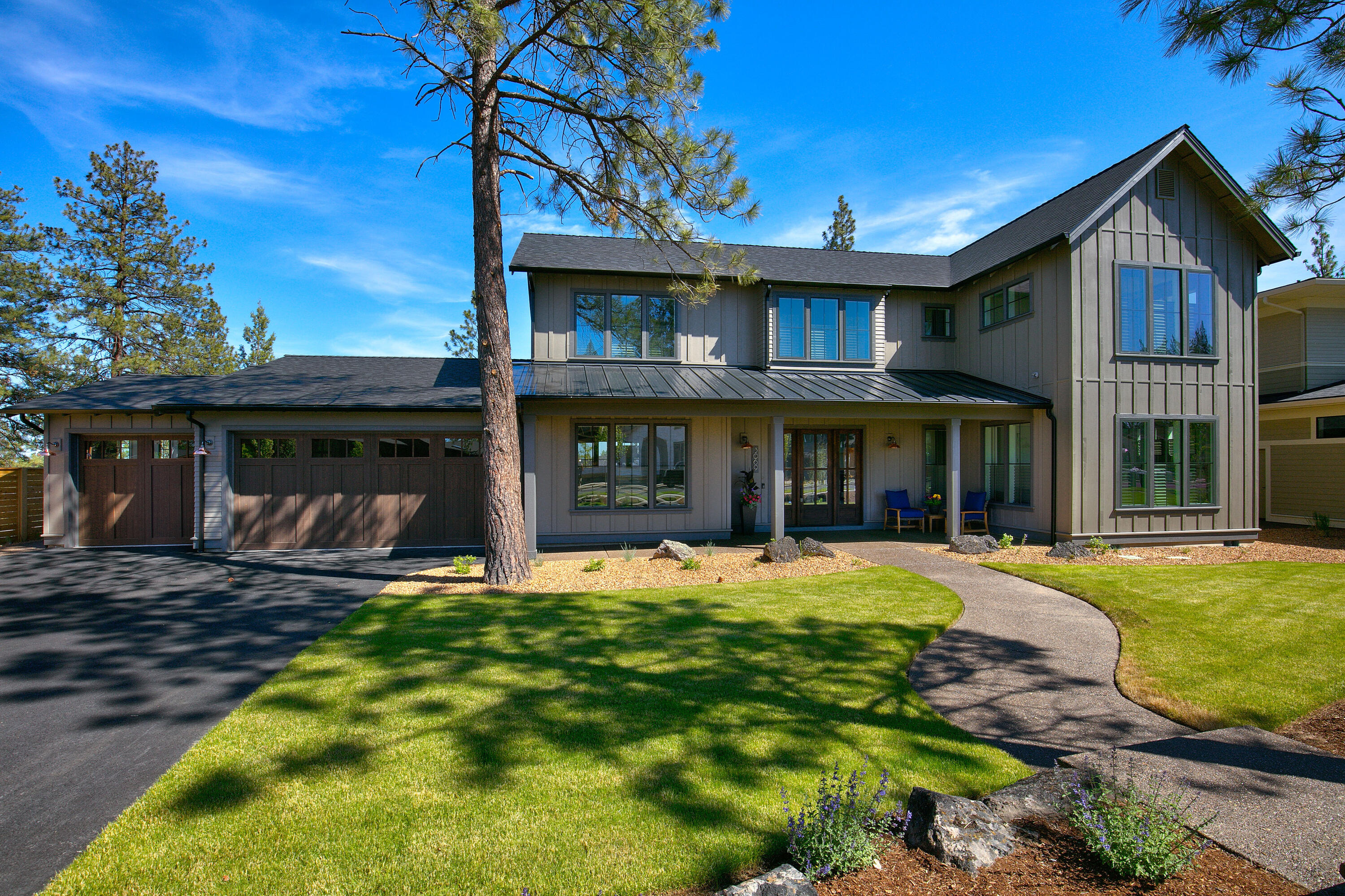 Luxurious modern farmhouse style home by award winning Structure Development NW in the highly sought after Discovery West neighborhood. Enjoy uncompromising craftsmanship & finishes throughout this masterpiece. Fenced side garden/dog run. Soak up the abundant sunshine in the open concept great room by the fireplace while fresh mountain air flows in through the oversized sliding doors that seamlessly integrate the indoor & outdoor living areas. After a long day of work or play, unwind in the private, tranquil backyard. Entertain in the magnificent kitchen with an oversized island, pantry & lots of storage. Primary suite on main level with freestanding soaking tub, curbless tile shower & walk-in closet. Office, mudroom & laundry room also on the main level. Large bonus room, two bedrooms & a full bathroom on upper level. Situated on one of the large premier lots, this new construction home has a triple-car garage & is Earth Advantage Certified.