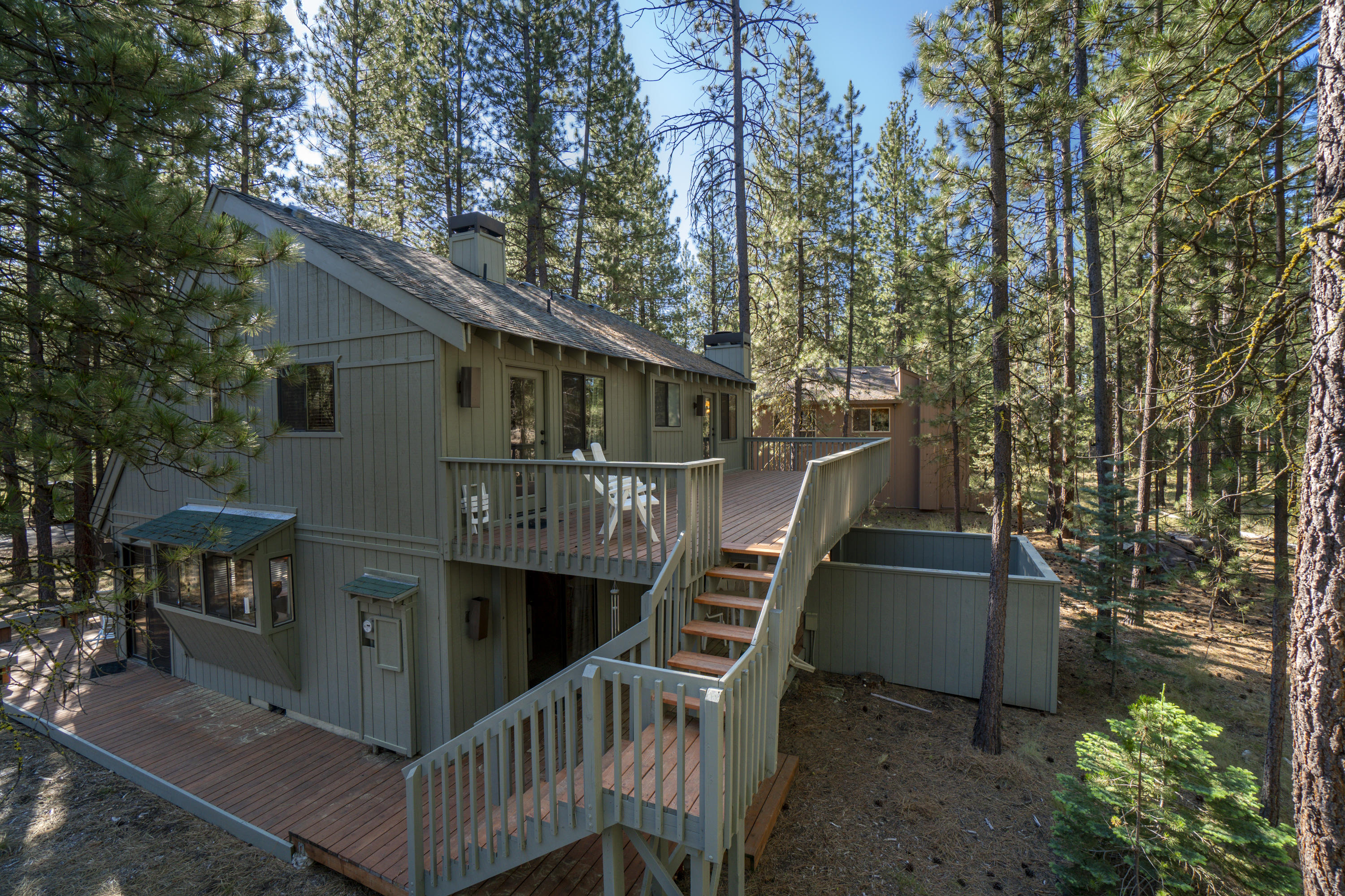 Memories are waiting in this Chalet near the Sunriver, walking and bike paths, parks, tennis and pickleball, and Sunriver Village with great restaurants and pubs. Sold fully furnished. The property boasts a great open living space with wood ceilings and wood accents giving you the Sunriver Lodge experience, 3 bedrooms with great lodge décor, complete wrap around deck and an upstairs deck with access to both bedrooms with views of the common space.