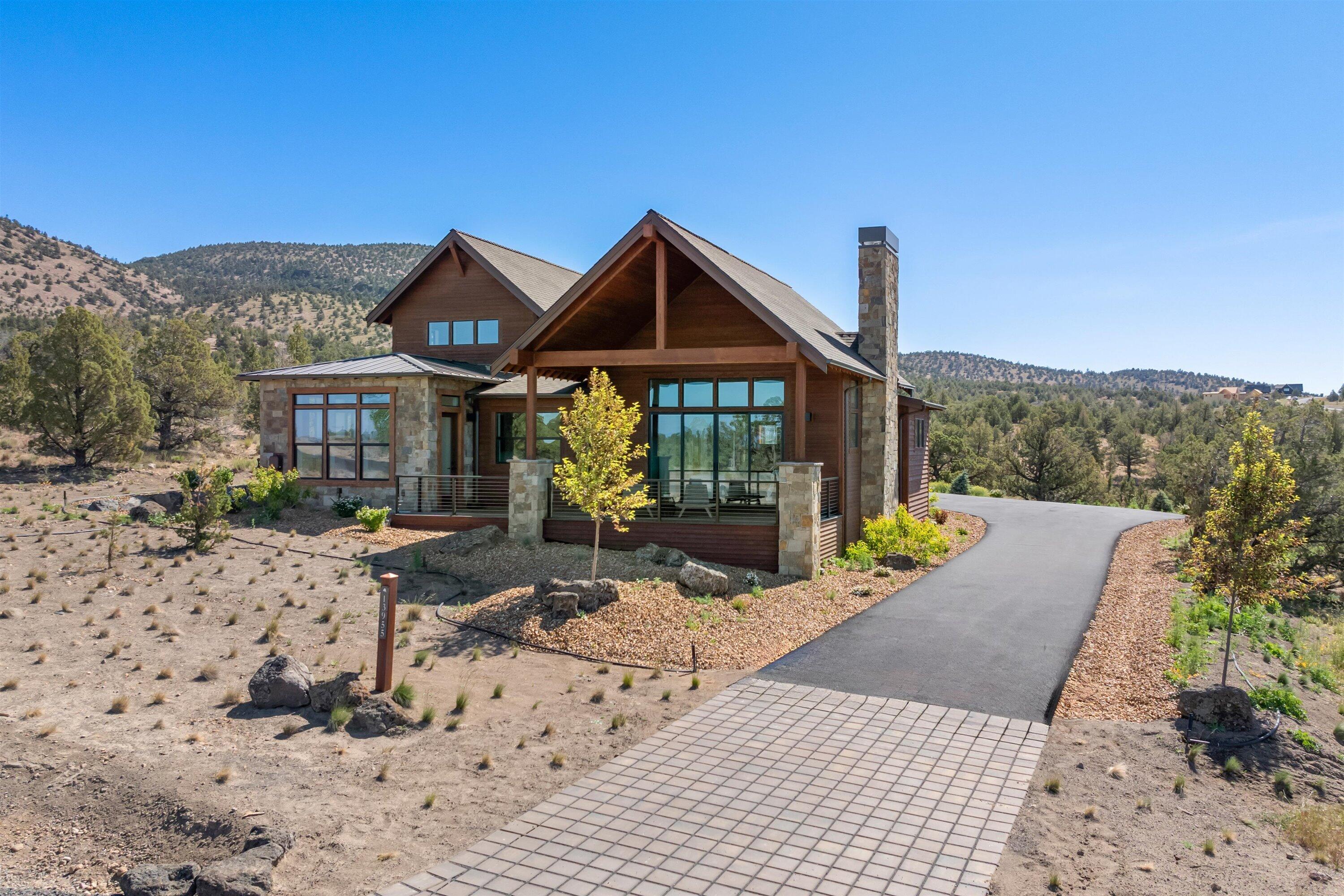 Stunning New Construction home with spectacular views of the Cascade Mountains. Enjoy mesmerizing Brasada sunsets as you relax on the front deck. Out back, this home offers a serene outdoor experience with views of the Powell Buttes. As you enter this beautiful home with modern chic finishes, you are greeted with an abundance of natural sunlight through the expansive windows in the great room openly flows into the spacious kitchen. The primary bedroom is located on the main floor with access to the deck, spacious walk in closet, and soaking tub. Additionally on the main floor, is an office, a laundry room, and a guest bedroom with full bath. Upstairs you will find another bedroom with full bath and a rec room. Completing this home is a roomy three car garage.