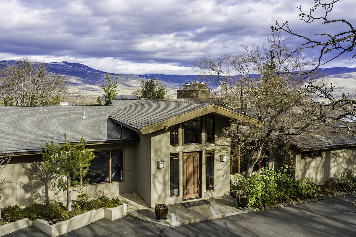 Rare offering! Truly beautiful property w/rare in-town Ashland setting on 4 irrigated acres. Gated entry leads to stunning 5551 SF mid-century view home including 1 bedroom & 1 bath apartment with separate entrance. Fabulous entry w/vaulted ceiling leads to incredibly attractive great room w/wide-plank Cherry floors, walls of windows w/prominent mountain views, stacked stone wood-burning fireplace & hearth & dreamy chefs kitchen w/6-person dining bar. The open kitchen is heart of the home & features uniquely beautiful rainforest marble counters, Thermador range, SubZero & walk-in pantry. Informal & gracious formal dining. Office areas & library w/fireplace. 5 bedrooms & 5 baths. This home has wonderful space & the grounds are glorious. Large lawn areas, flowering plants, mature trees, fruit orchard, stone walkways & walls, inground pool & Koi pond & cascading water feature framed by forever views. 3-car garage. City services. Development potential... SF to be verified by buyer.