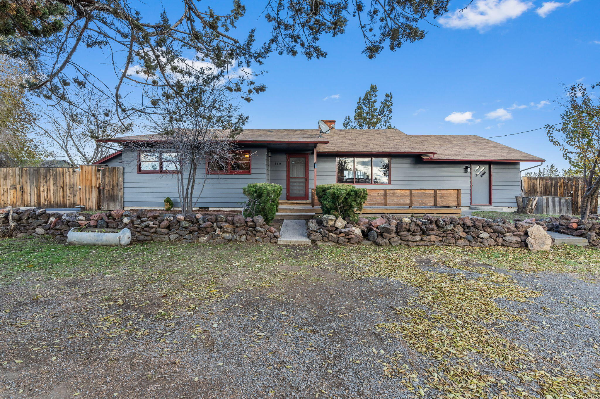 Take a step back in time to the 1950's era of quality craftsmanship and character. Nestled in a cozy corner of a peaceful friendly neighborhood, imagine sipping your coffee on the front porch gazing over the valley below, the peek-a-boo views demand your attention. Walk through freshly painted hallways, and you are welcomed into the spacious living room with a brick fireplace. The stunning hardwood floors, darling 1950's kitchen, and huge master bedroom with separate entrance are just a few of the highlights this house has to offer. With four bedrooms, and two bathrooms, this house has unlimited potential for living accommodations. Take a tour of the fully fenced  backyard, and you'll find a spacious 12x14ft storage shed, outside storage boxes for storing garden tools, and a designated fire-pit. The two car detached garage has built in work shelves, cabinets, and a separate back room that was used previously as an artists studio. Come look, you won't be disappointed.