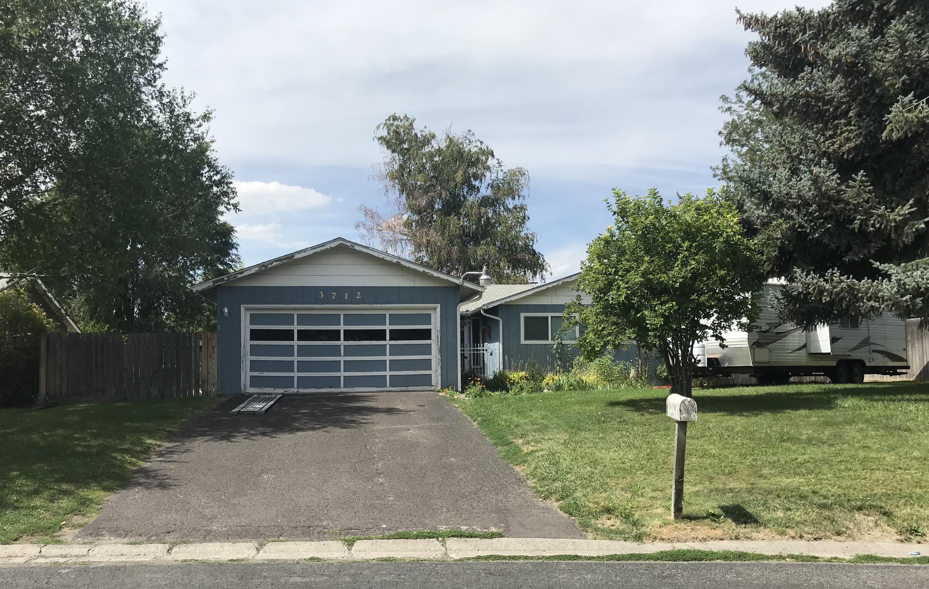 BACK ON THE MARKET at no fault of the home!!!  Opportunity awaits in Sunset Village! Come put your own touch on this 3 bedroom, 2 bathroom fixer. Home sits on over a quarter acre in town. The quiet street & pride of ownership show all around. Mature trees shade the backyard and concrete patio area. RV parking, new exterior paint and mature landscaping top off this great home.