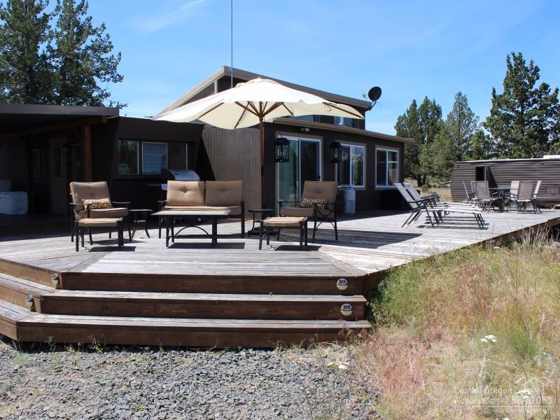 Super cute & totally remodeled 8X40trailer w/kitchen, B/R, eating nook & storage. Permitted Great room w/#2 bedroom & storage. Over 1000sf of decking-covered and open w/Mt. Jeff & Hood views. Solar, batteries, generator back-up and more. 8X30 guest trailer also remodeled and ready for family & friends. You have to see this one! Move-in ready. Come enjoy all the 3 Rivers & Central Oregon has to offer.