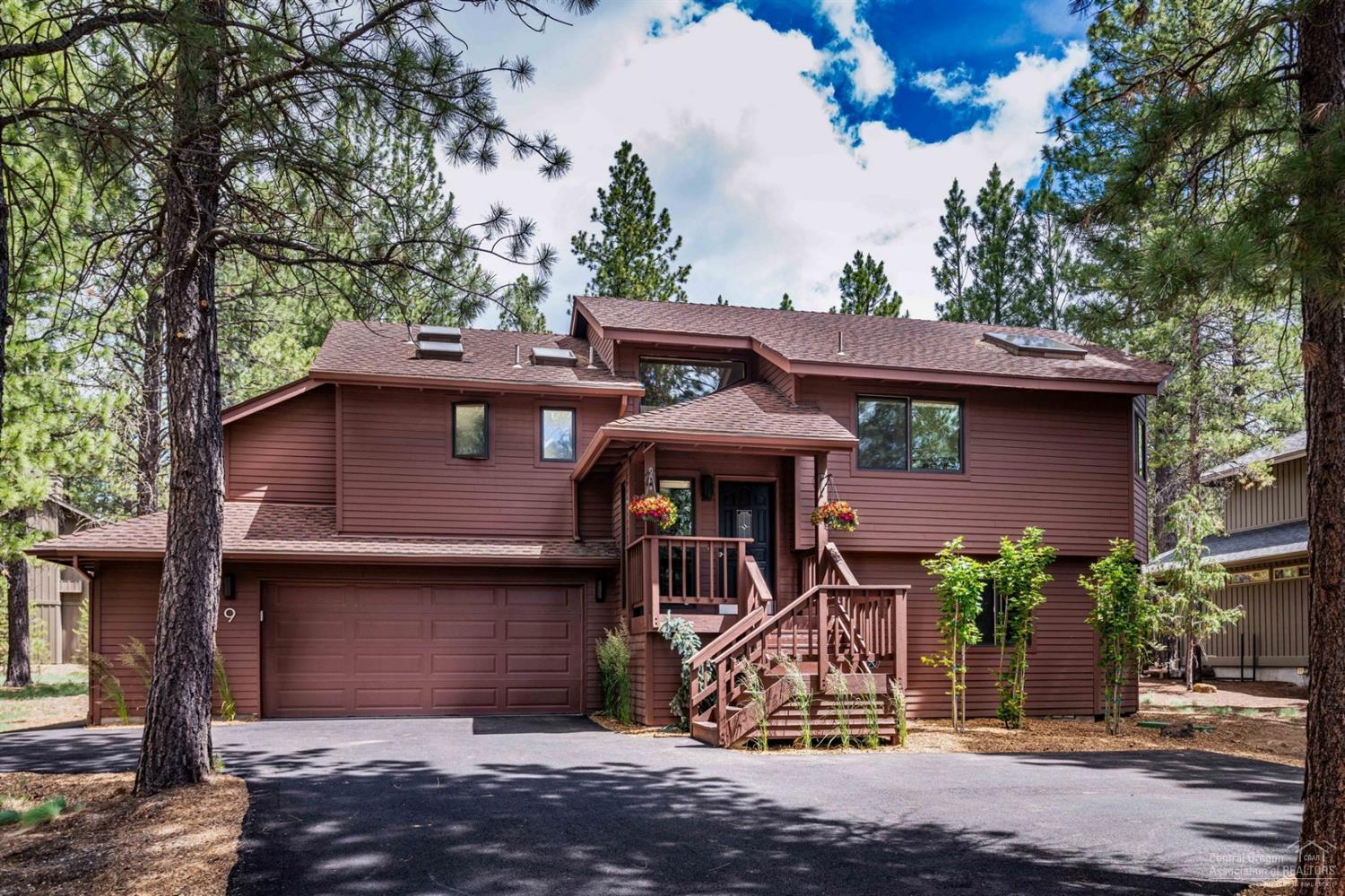 Wonderful setting, at the end of a cul de sac, with trails leading from the back door to the National Forest, yet close to the Woodlands Golf Course and the amenities of both Sunriver and Bend. Cozy and comfortable home with the great room and master on the upper level, and 2 bedrooms and bath down. The open great room/kitchen has vaulted ceilings, lots of windows & a skylight. Brand new wood floors in the great room and on the stairs, and new light fixtures and ceiling fan. The kitchen is recently remodeled with a new gas stove, new refrigerator, new solid granite countertops and refinished cabinets including pull out pantry storage. Access to the private deck which extends across the rear of the home. New barbecue by the kitchen, new hot tub by the master bedroom. New carpet in bedrooms. Dry outdoor storage is perfect for kayaks & bikes. Attached 2 car garage with additional work area and storage. Pride of ownership shows. This home is the perfect retreat or a great vacation rental.