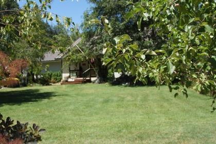 The Oregon Dream at its best. This beautiful property is less than 20 minutes from town with the quiet seclusion desired by most. Immaculate home with 2 masters, one upstairs and one on the lower level. 3 baths a bonus room which could be a 4th bedroom. Cool off in year round slate creek. Soak in the hot tub or enjoy the fireplace. Serene gardens, ponds, waterfalls, Koy, walkways surround the home so any time of day is shaded and peaceful. Magnificent weeping willows keep yard shaded and cool. RV garage, shop, mancave and art studio, 19.9 acres mostly fenced and cross fenced for animals, barn, hay barn, chicken house, tack romm +. large developed spring provides the water. There are several springs on this property. 82 acres adjacent is also available for the buyer needing more land See Listing #2973305