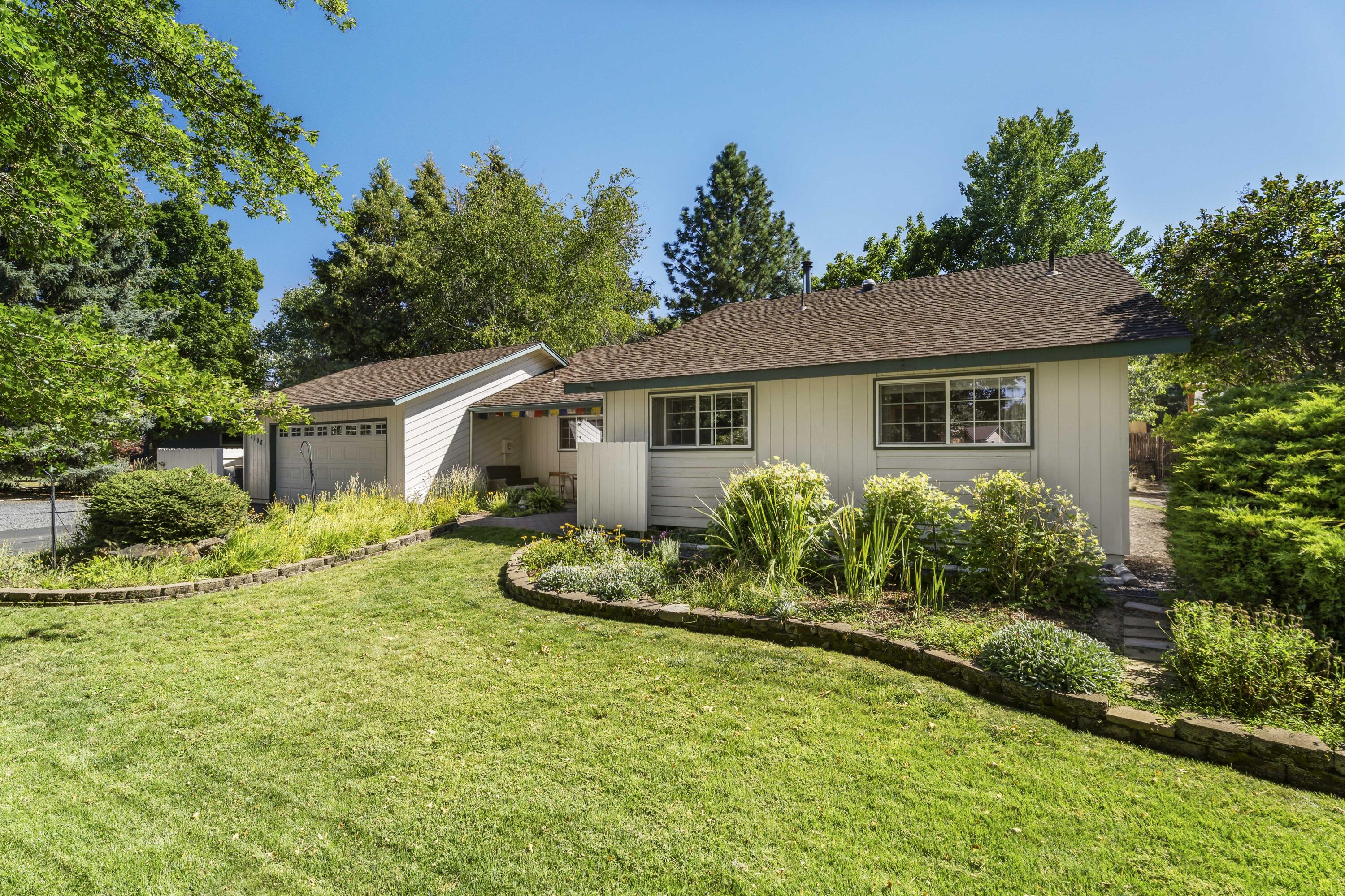 Step into this groovy '77 Ranch Home with 3 bedrooms, 2 baths and 1,464 SF on nearly half an acre of lush landscaped beauty. Retro character meets modern potential, ready for your personal touch. Picture mornings in the greenhouse turned art studio, afternoons in the garden beds, and peaceful evenings under mature trees. Irrigation rights keep everything thriving. There is space for your RV with full hookups and room that may allow an ADU (buyer to verify). Close to town, trails, Larkspur Park and the Community Center. Less than a mile to Reed Crossing Market: Bagels & Coffee, Greek food, Tacos, Cascade Lakes Pub! This home is a canvas for creativity and a lifestyle that feels both timeless and fresh. Gardenia Avenue invites you to make it your own soulful retreat.