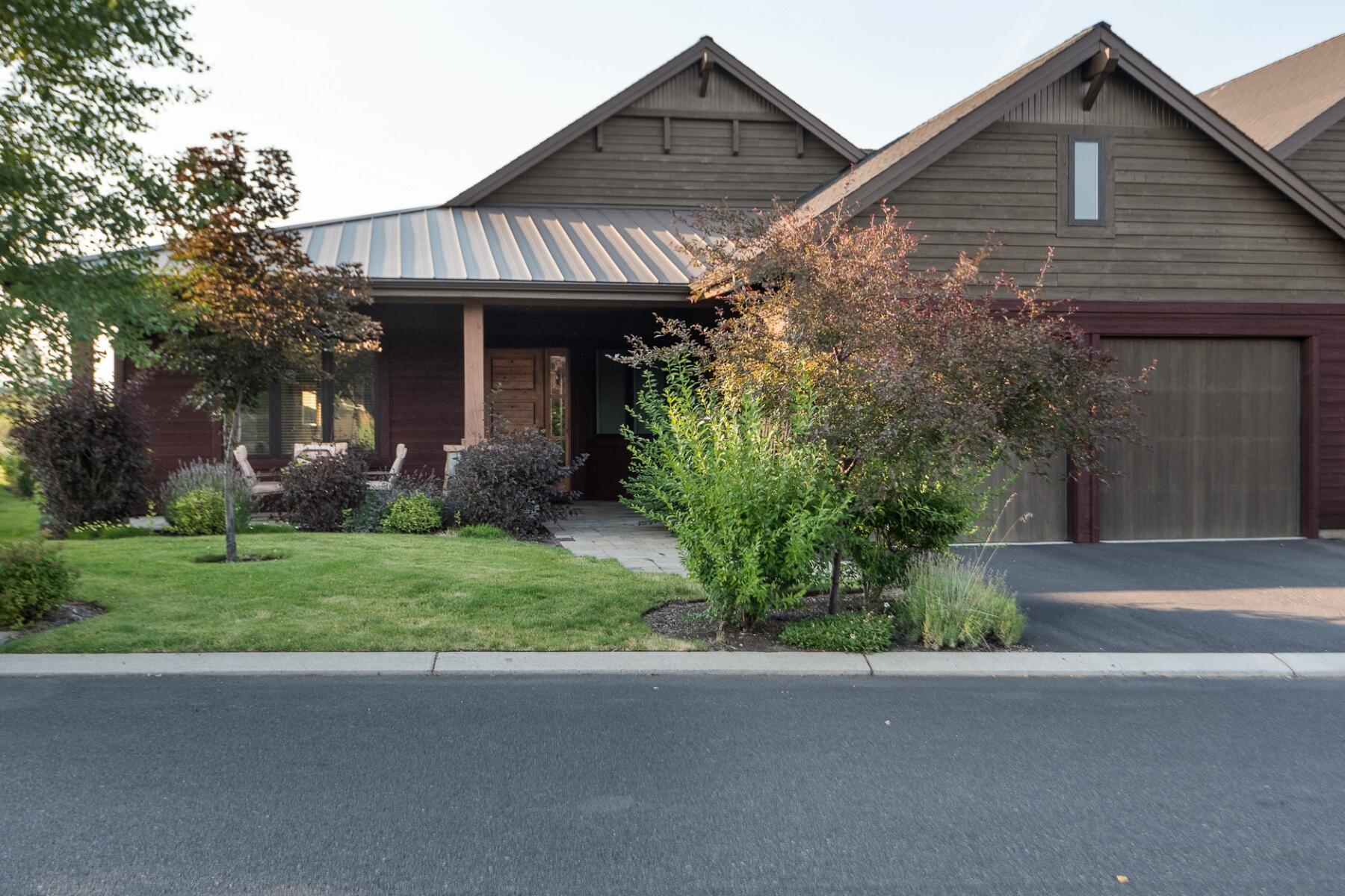 Perched on the ridge above the 11th tee of Tetherow Golf Course with expansive views of the course and the Cascade Mountains is an elegant single level, luxury Triple Knot townhome. Features include an open floor plan of 2,367 sf with beamed vaulted ceilings, 2 en-suite bedrooms, study, powder bath and 2 car garage. The gourmet kitchen features two islands, Jenn Air appliances, and modern cabinetry with ample storage space. Take a breath of fresh air and enjoy nature and views from the back patio. Low maintenance lock and go living with HOA's maintaining exterior landscape and the building. Owners receive exclusive access to the Tetherow owners pool. Tetherow social membership is required and amenities include access to Tetherow Sport's pool, pool side service, discounted dining, lap swim, exercise classes, social events and more. Fantastic westside location with easy access to outdoor recreation, dining, shopping and more!