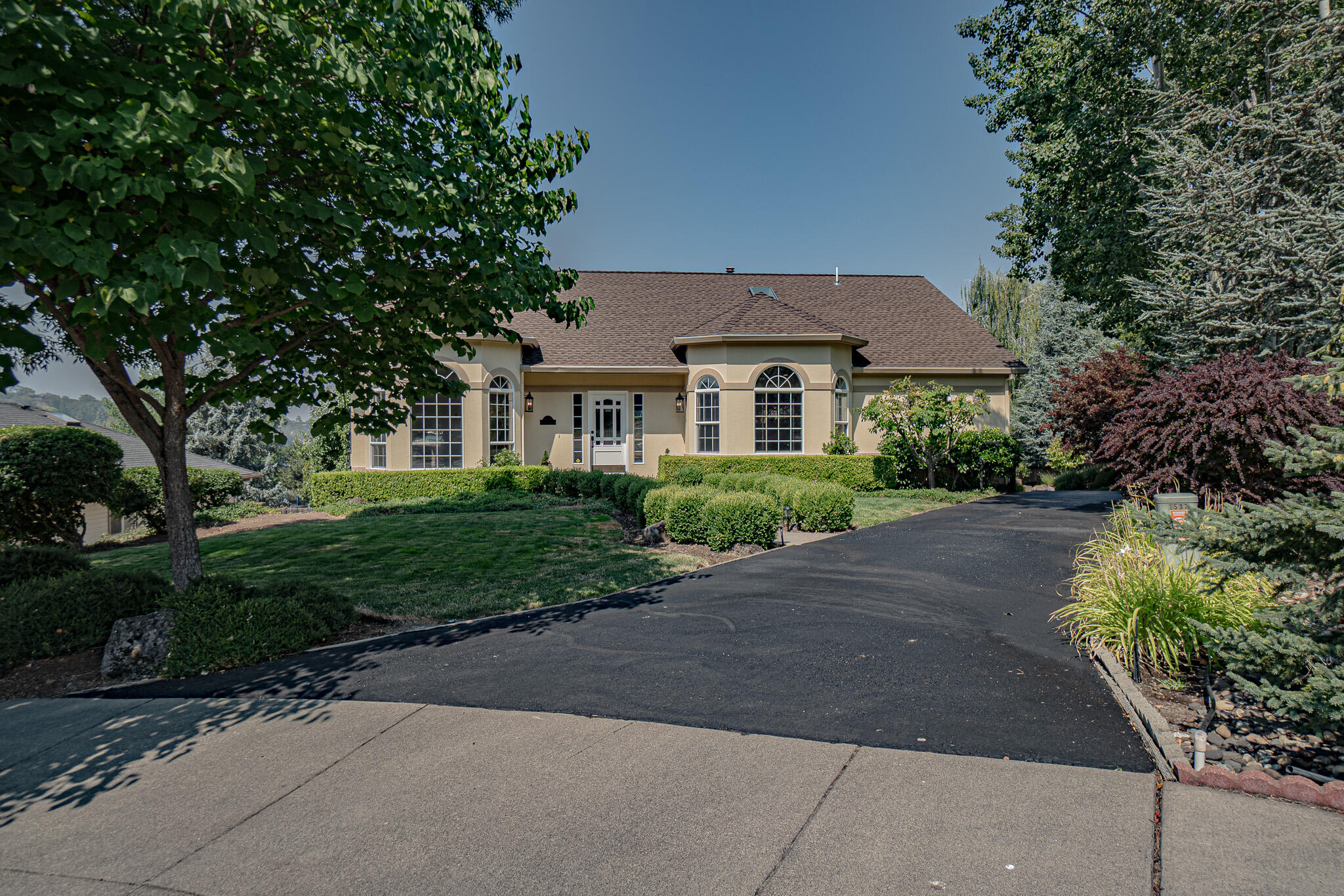 Experience the charm of this exquisite Gary Shaw-designed residence nestled on a serene cul-de-sac. This impeccably maintained home boasts 3 bedrooms, 3 bathrooms, and a dedicated office. The open floor plan seamlessly connects a cozy family room with a spacious living room, perfect for both relaxation and entertaining. Recent updates include fresh paint, a new roof, upgraded HVAC, and a host of interior enhancements. The kitchen showcases elegant quartz countertops and a generous island, while the primary bedroom, located on the main level, features French doors and a beautifully remodeled en-suite bathroom. Outside, you'll find a pool surrounded by redwood decking, a mahogany deck on the main level, a soothing water feature, ample parking, and a gated entrance, making this property a true retreat.