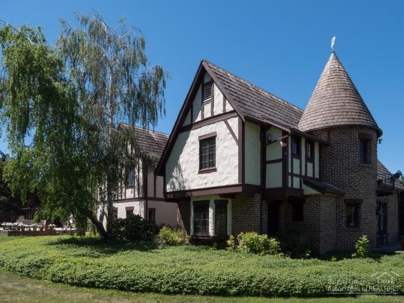 Fabulous English tudor designed by Frank C Clark with classic lines and character. Perfect for an avid equestrian or a potential vineyard. Water rights provided by MID. In-ground 20X40 saline pool. Detached guest quarters/artist studio, multi-stall barn plus a pole barn. Gourmet kitchen featuring Sub-Zero and Thermador. Beautiful living room with 17 foot beamed ceiling and hardwood floors. This is one of the Rogue Valley's most majestic homes. A must see!