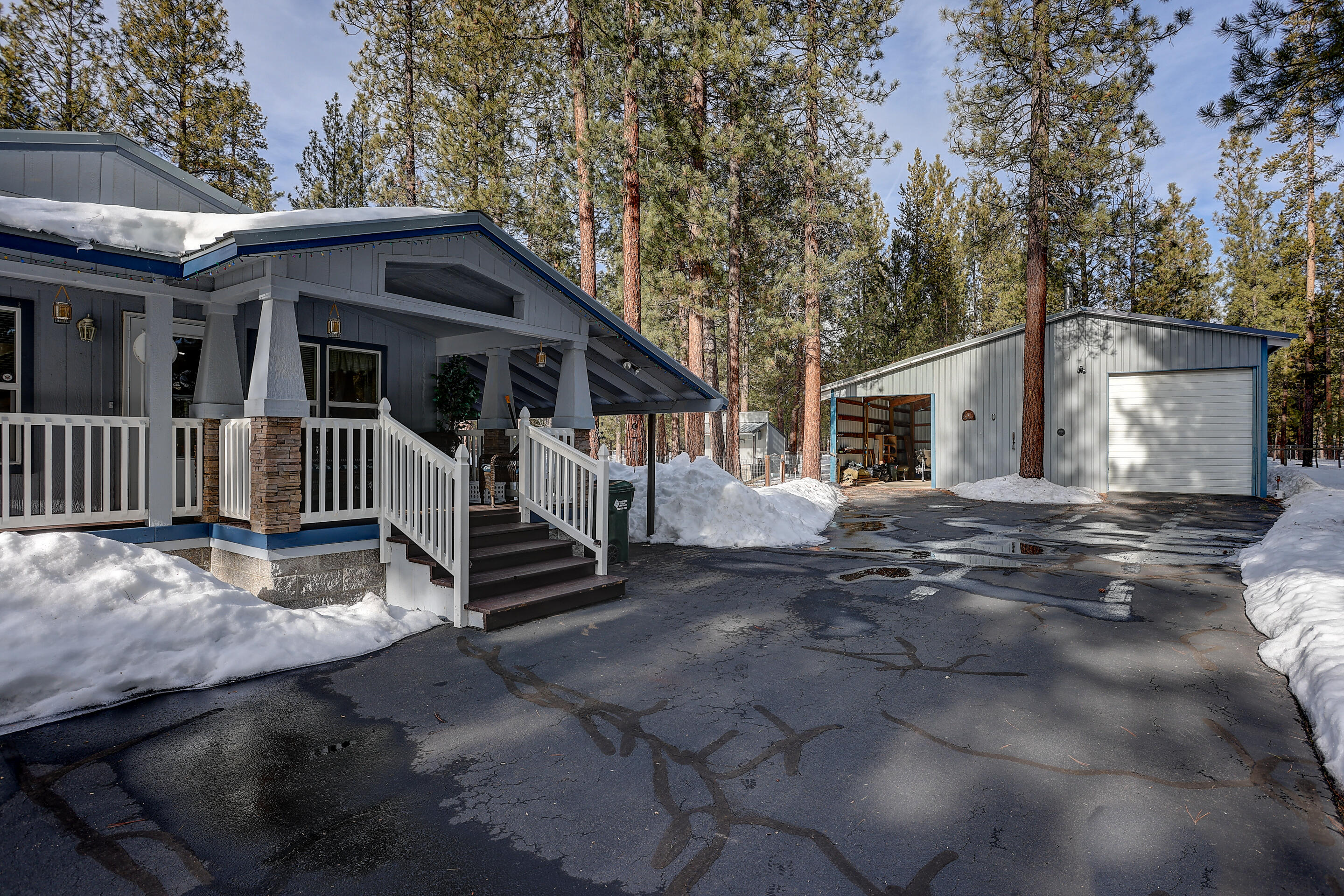 Located in the tall pine trees of the Ponderosa Pines neighborhood. This well maintained 2007 manufactured home, 3 bed, 2 bath, 1620 SF. a 36 x 30 shop has a full bathroom with shower & own water heater, an additional cover storage area 36 X 12. This home offers an open floor plan with great light, new laminate flooring in the living & dining room, large kitchen w/ island, breakfast bar, laundry room, large master bedroom & bath, covered porch, paved street. Come & enjoy all it's surrounding lakes, rivers, trails and all that Central Oregon offers!