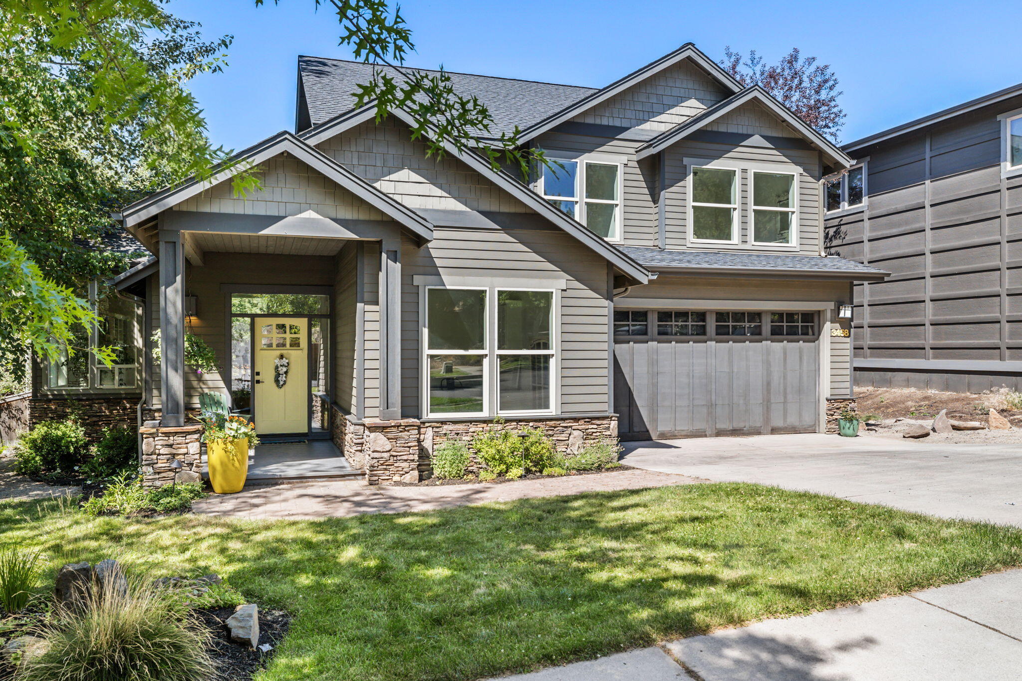 Come peak at this fantastic property in Awbrey Park! The neighborhood's beautiful tree-lined streets and proximity to Sawyer Uplands Park and the river make it a desirable location. The 3-bedroom, 2.5-bath home with an office has some excellent features, such as concrete countertops and barn doors that add a touch of luxury. The primary suite is particularly impressive with a walk-in tile shower that includes a bench and double shower heads with a handheld attachment. The tandem garage with epoxy flooring is a practical and attractive feature for those who appreciate storage and aesthetics. The mature well-landscaped yard and hot tub are a perfect place to relax and enjoy the natural surroundings. If someone is looking for a beautiful, comfortable, and upgraded home in a great neighborhood, this one is a must-see property. Owner is a licensed real estate agent in Oregon.