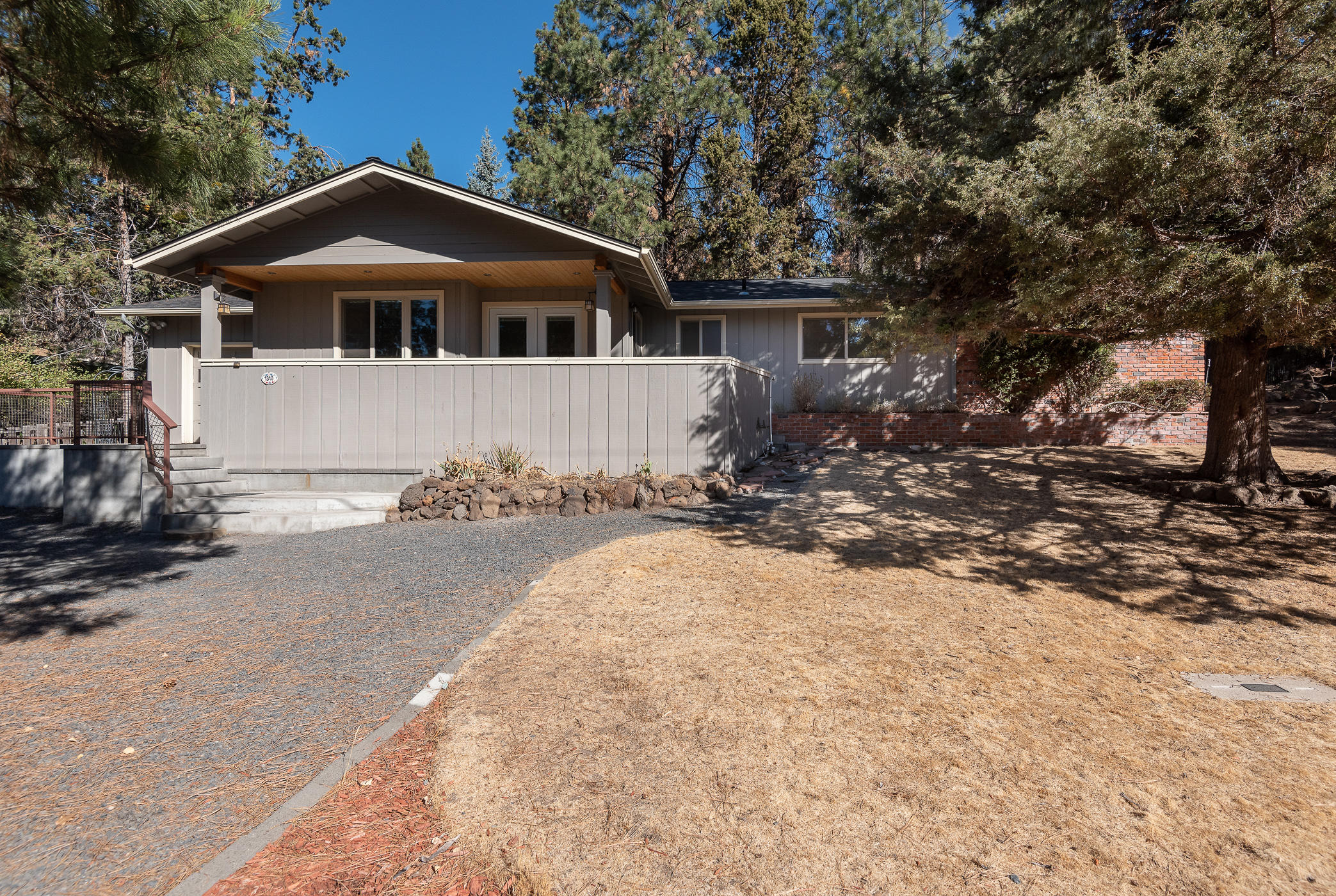 Great opportunity to own a short term rental on Bend's Westside. This single level home set in the West Hills is conveniently located close to shops, restaurants, hiking and biking trails, parks, the Deschutes River, and Mt. Bachelor. Featuring a spacious renovated kitchen, stainless steel appliances, open greatroom, tile floors, new interior paint and carpet, new furnace and AC unit, gas fireplace, fenced .32 acre lot, private hot tub, storage shed, green house, outdoor oven and BBQ, private park like setting, all on a quiet dead end street. Don't miss this fabulous opportunity!