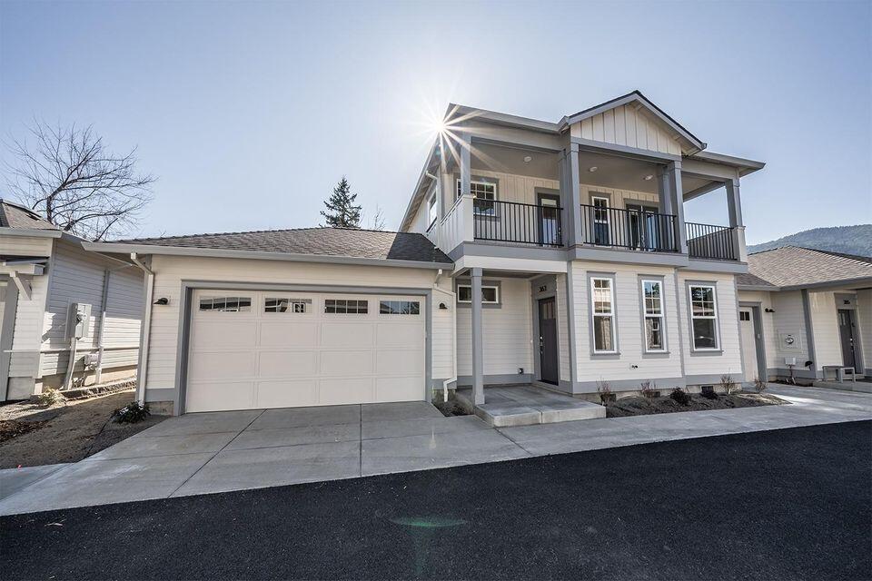 Unbelievable opportunity to own this three bedroom two bath luxury Ashland townhome centrally located a stones throw from Southern Oregon University, shopping, dining, entertainment and all that downtown Ashland has to offer. Earth Advantage platinum home has been tastefully designed by Rick Lindemann and expertly built by Suncrest Homes. Home has its own two car garage, fenced patio and 2nd story balcony, 9' main ceilings with master bedroom on main floor, quality appliances including a gas range, granite countertops and backsplash, gas fireplace, energy efficient LED lighting, soft close cabinets, under cabinet lighting and other high quality touches. Home was purchased as a second home and was only used roughly four months since purchased and is in immaculate, like new construction condition. Sellers are including beautiful custom made plantation shutters (a $20,000 upgrade) and a new stainless refrigerator to match existing appliances.